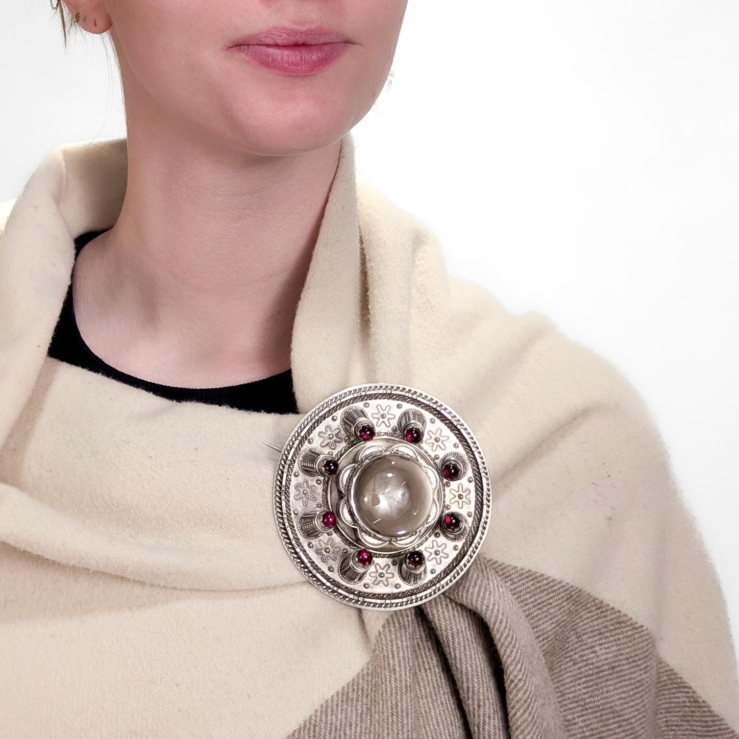 A fine, antique 19th Century copy of the Brooch of Lorn (or Lorne).

In sterling silver with rock crystal and garnet cabochons.

By the renowned jewelers, William Marshall & Co. of Edinburgh, Scotland.

This brooch is a faithful reproduction of the