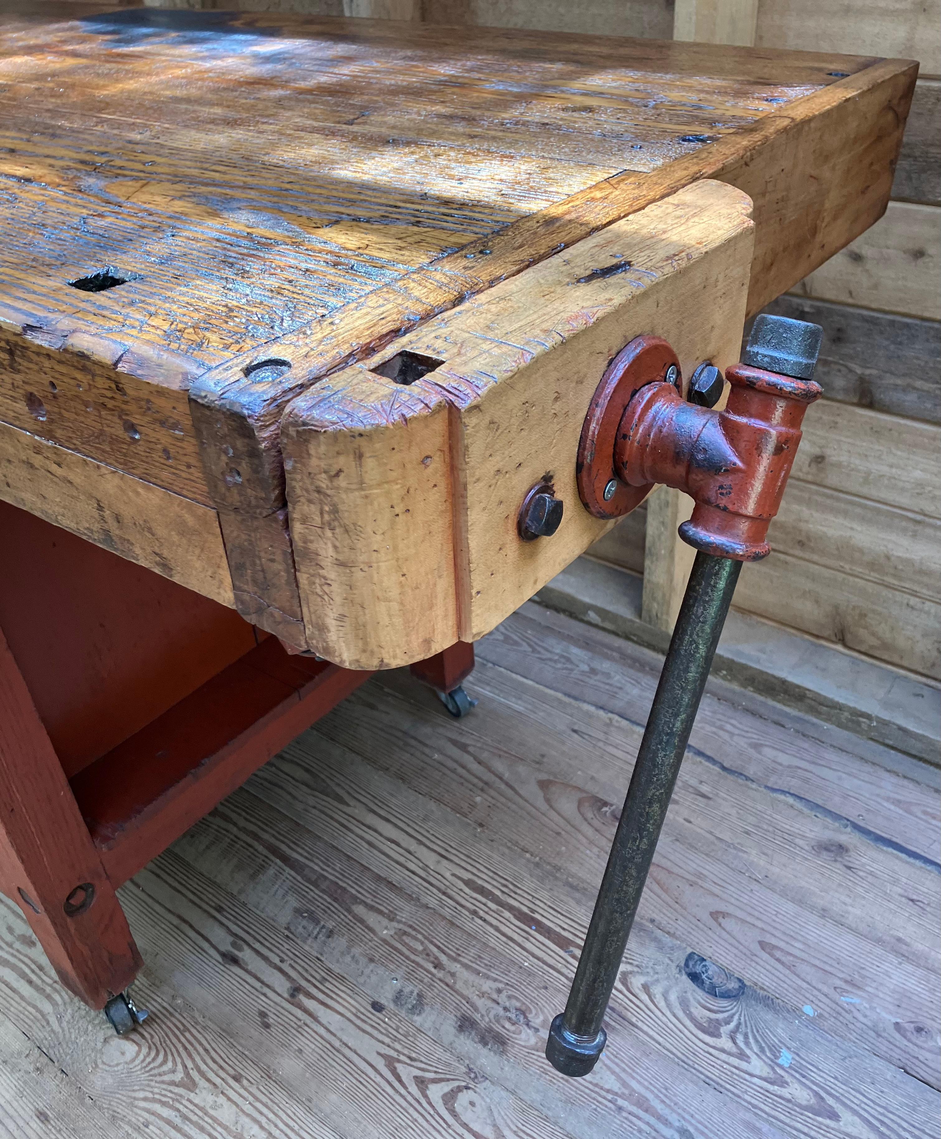 Amazing original 19th century workbench fresh out of the factory in Northborough
MA. Original red paint solid Chestnut 2 working vises. The 4 drawers are hand dovetailed and the drawer bottoms are hand chamfered. The top is flat with no tool tray so