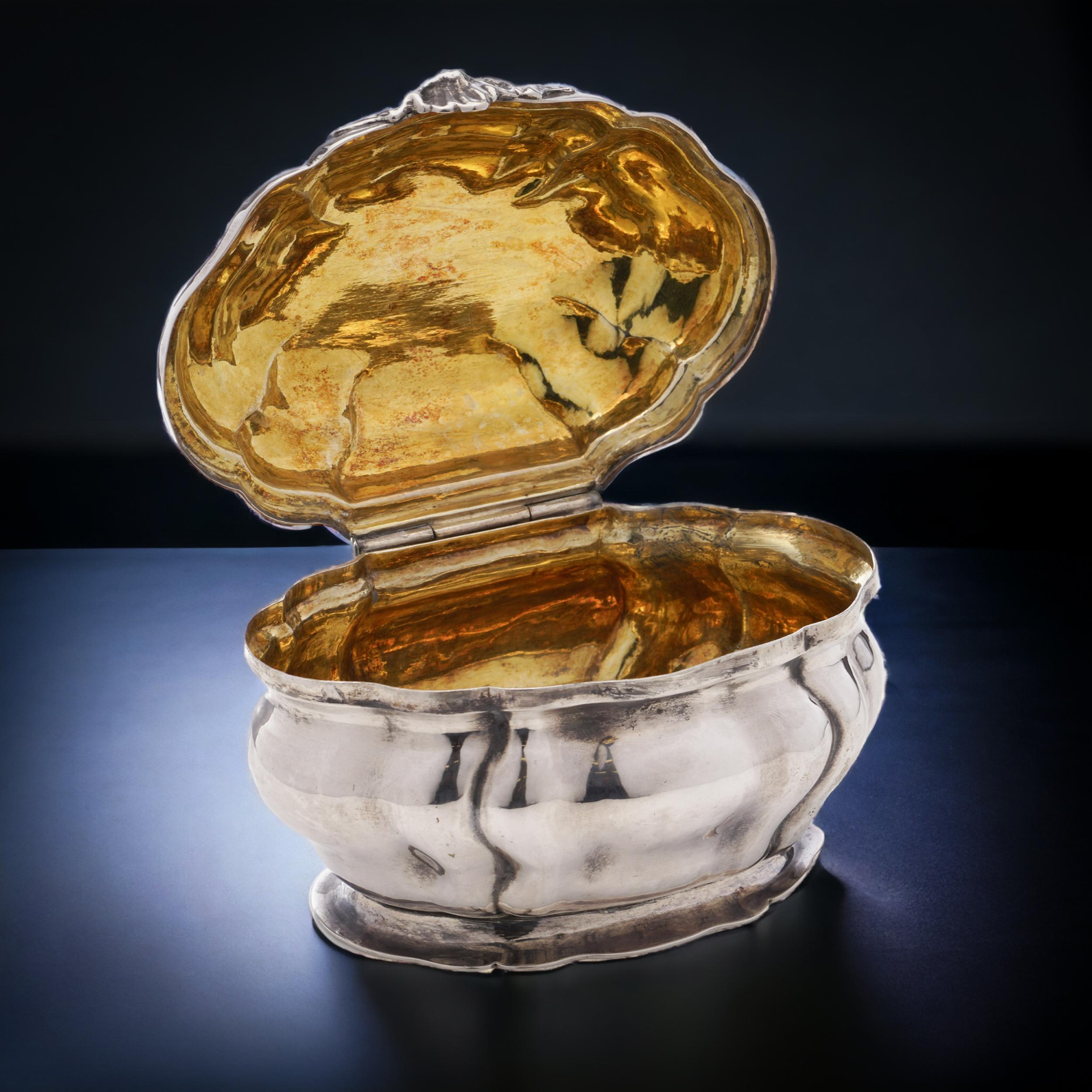Antique 19th century 800. German silver small oval Tea Caddy with Hanau marks. 
Maker: Unidentified 
Made in Germany, 19th Century 
Tested positive for 800. silver. 

The tea caddy is in an oval shape, with a hinged lid with the engraved family