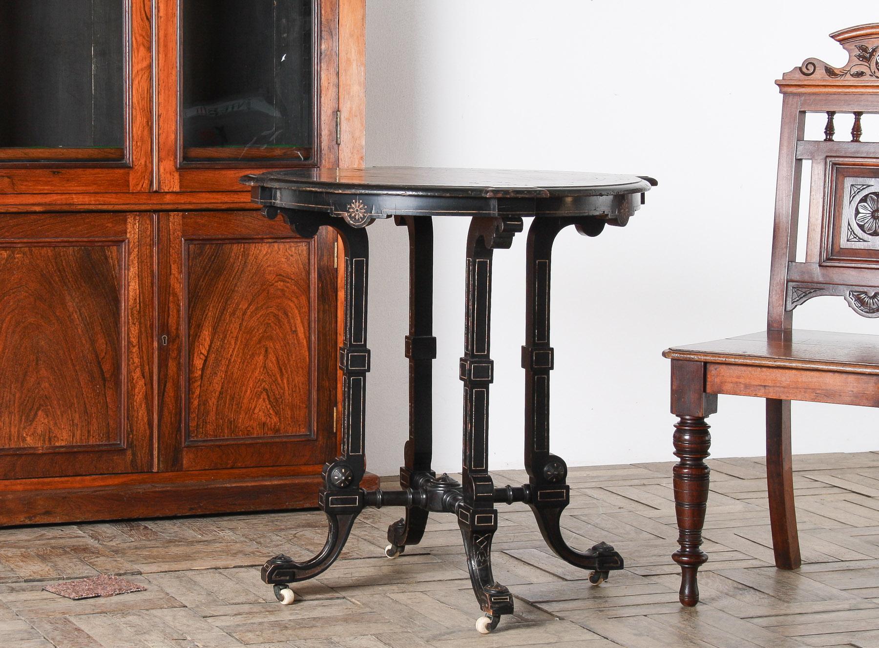 An exceptional Antique 19th Century Aesthetic Movement Ebonised Side Table, a superb example of craftsmanship that embodies the elegance of the era. This exquisite piece, possibly crafted by the esteemed furniture maker Gillows, features a