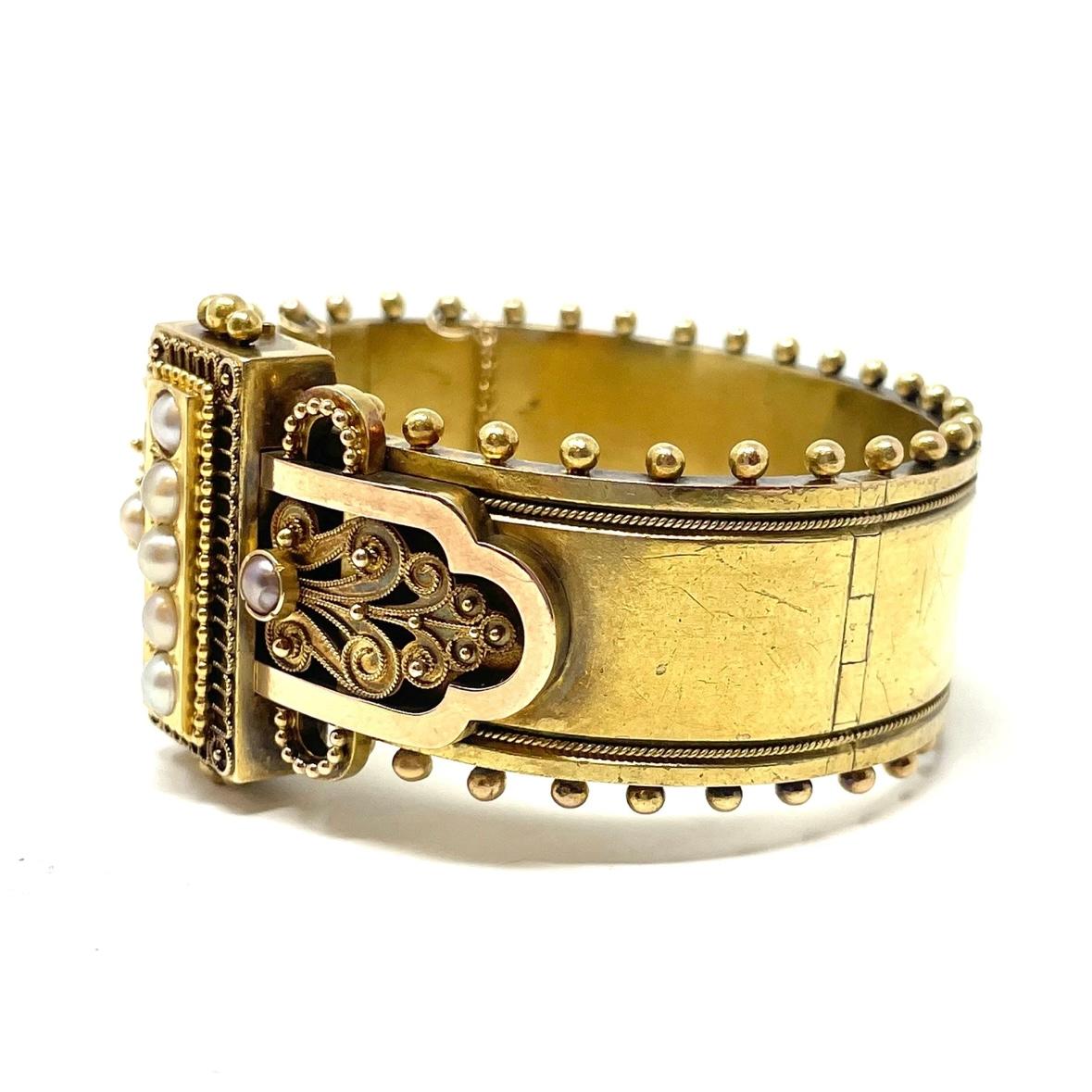 A quintessential Victorian Bangle in 14K gold with natural pearls, this substantial piece won't escape notice.

1 1/4