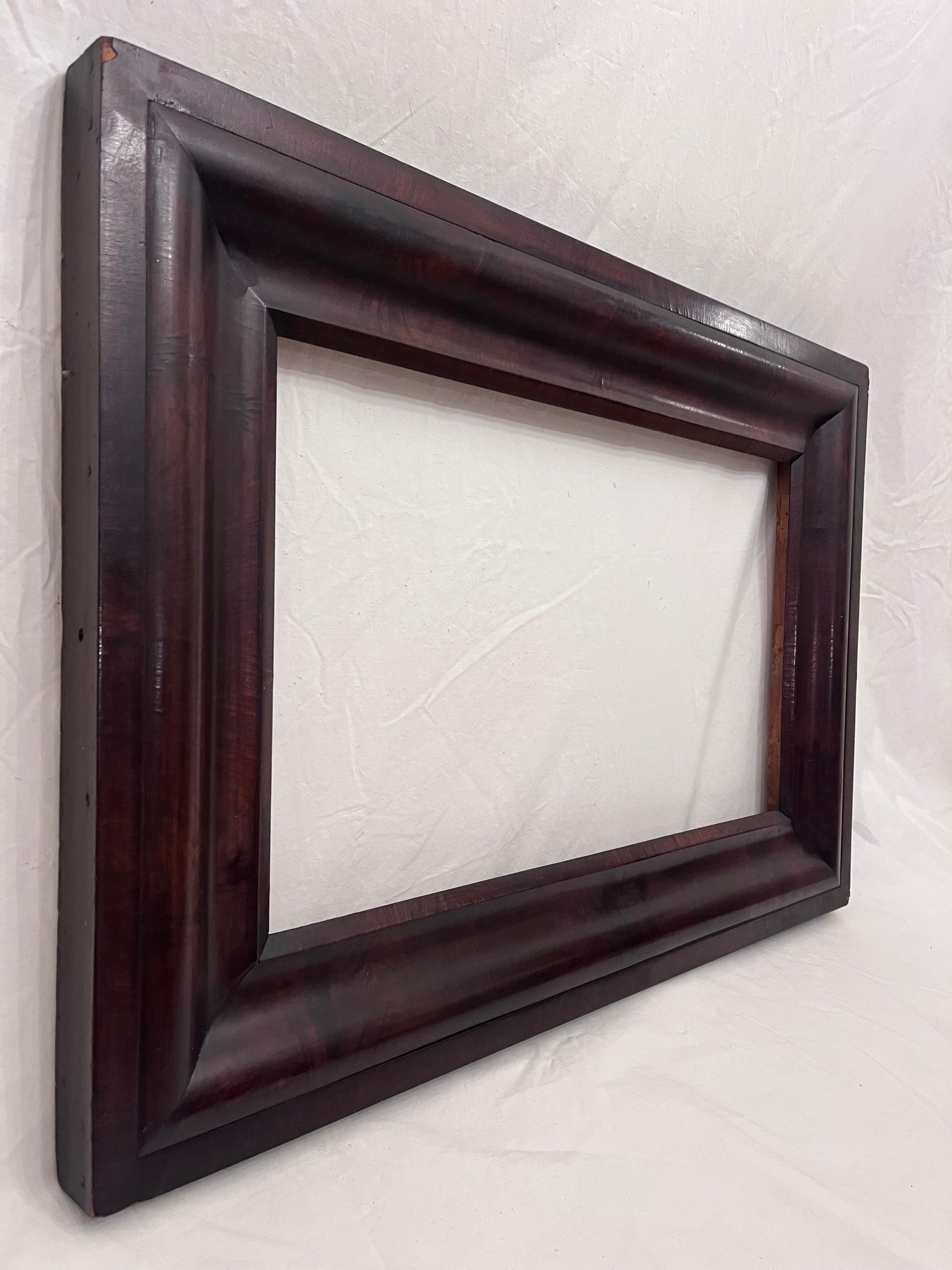 A beautiful and antique late 19th century circa 1870's American Empire style picture frame. The rabbet size (size that holds the art) is 22.25