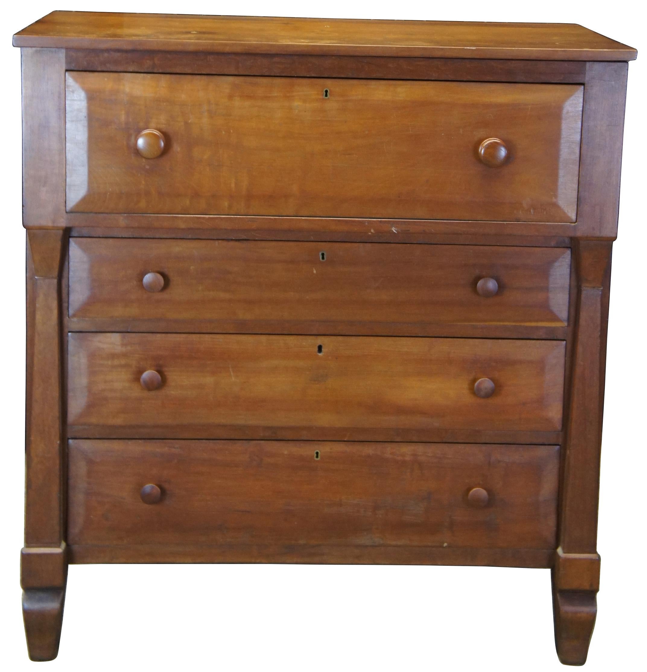American Empire tall chest, circa 1850s. Features a rectangular form with a pronounced top. Includes beveled drawer fronts, hand dovetailing and square tapered columns along the front. Made from walnut.
       