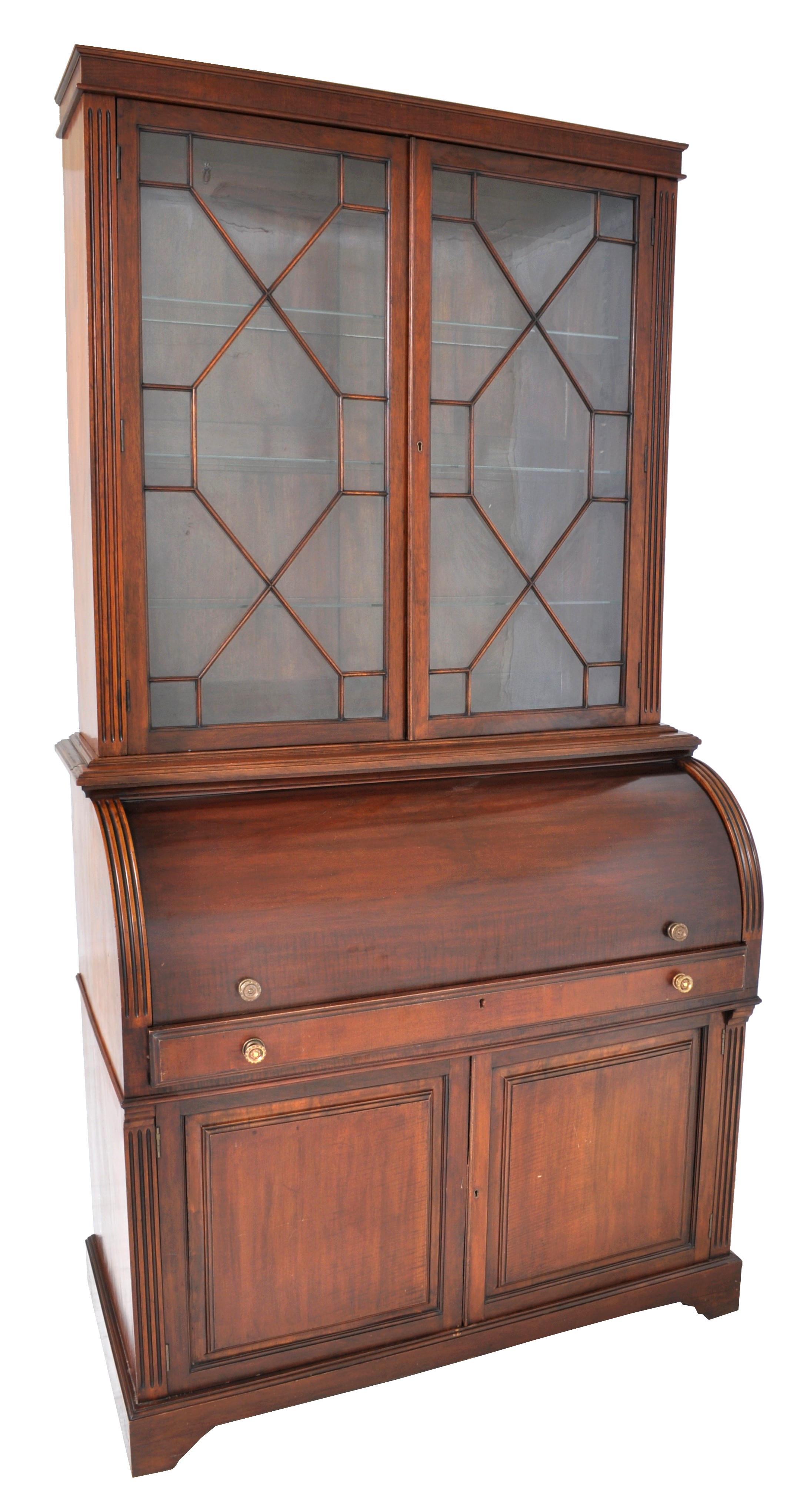 Fine antique 19th century american mahogany cylinder bookcase/secretary/desk, circa 1860. The bookcase having twin doors with astragal glazing and enclosing three shelves. The base having a cylinder roll top enclosing a fitted interior with drawers