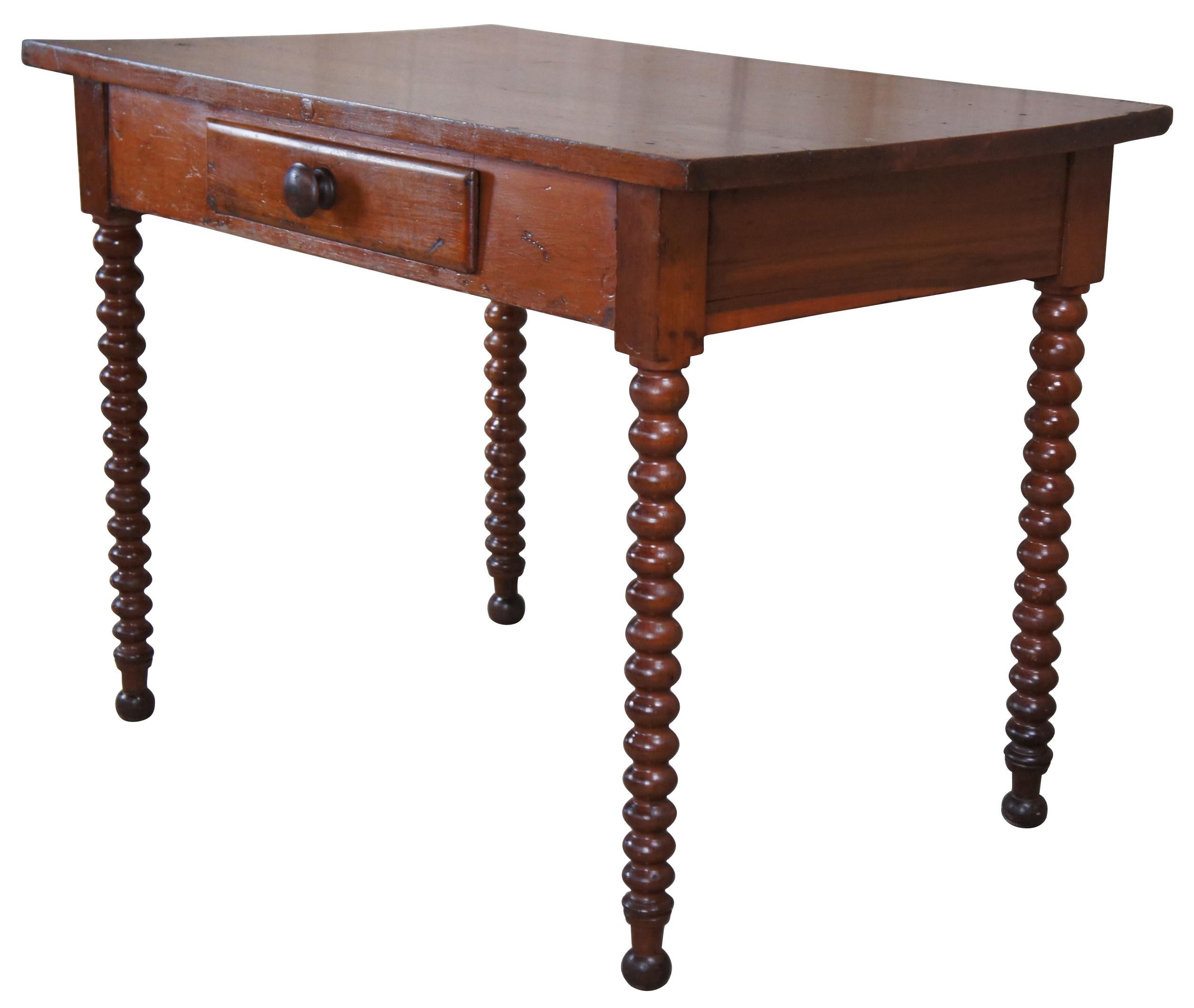 A beautiful American Victorian era writing desk. Made from maple with one hand dovetailed drawer. Features hand turned bobbin legs leading to bun feet.