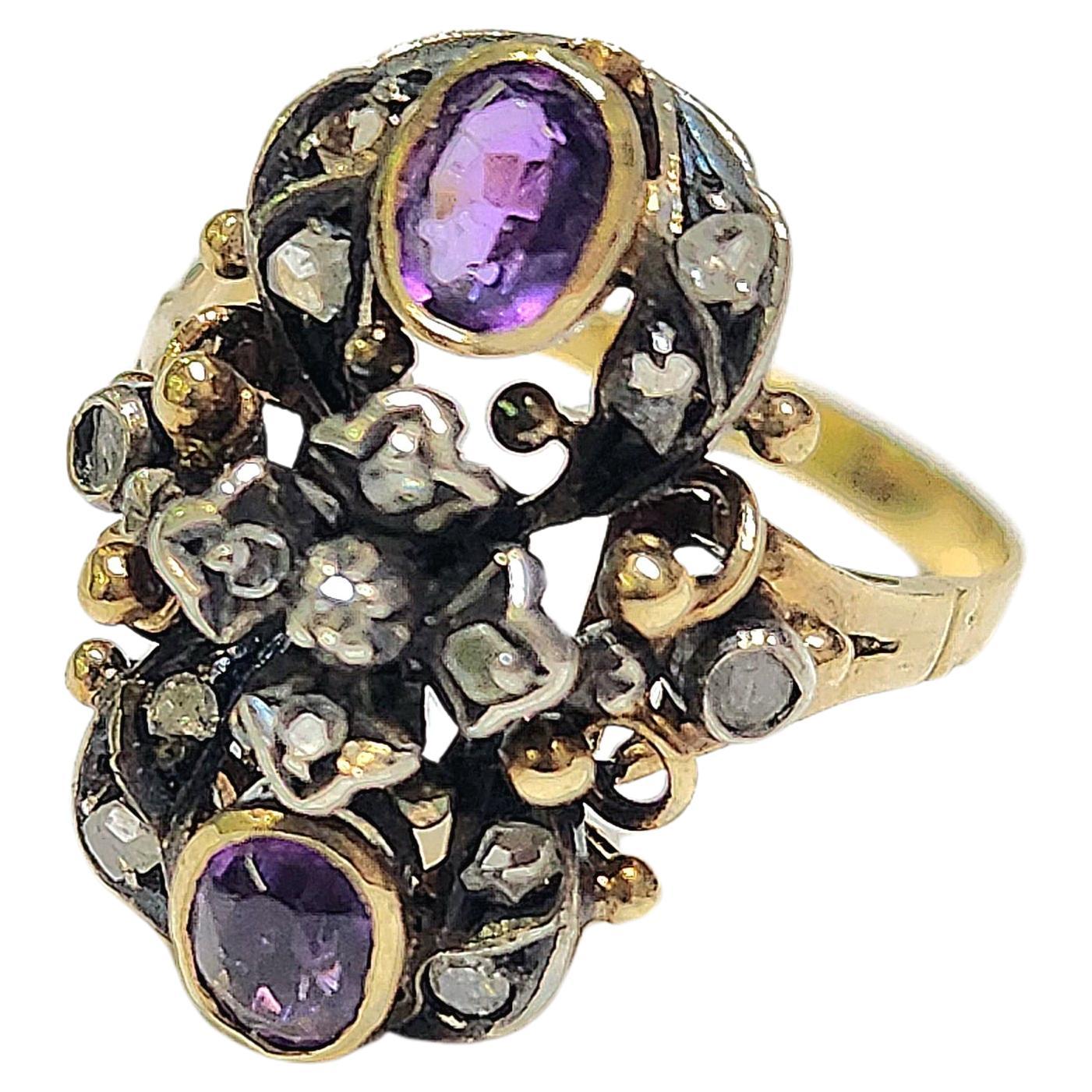 Antique amethyst ring centered with 2 natural pink oval cut amethyst decorted with rose cut diamonds in 18k gold setting with ornament design ring dates back to europe 19th century 