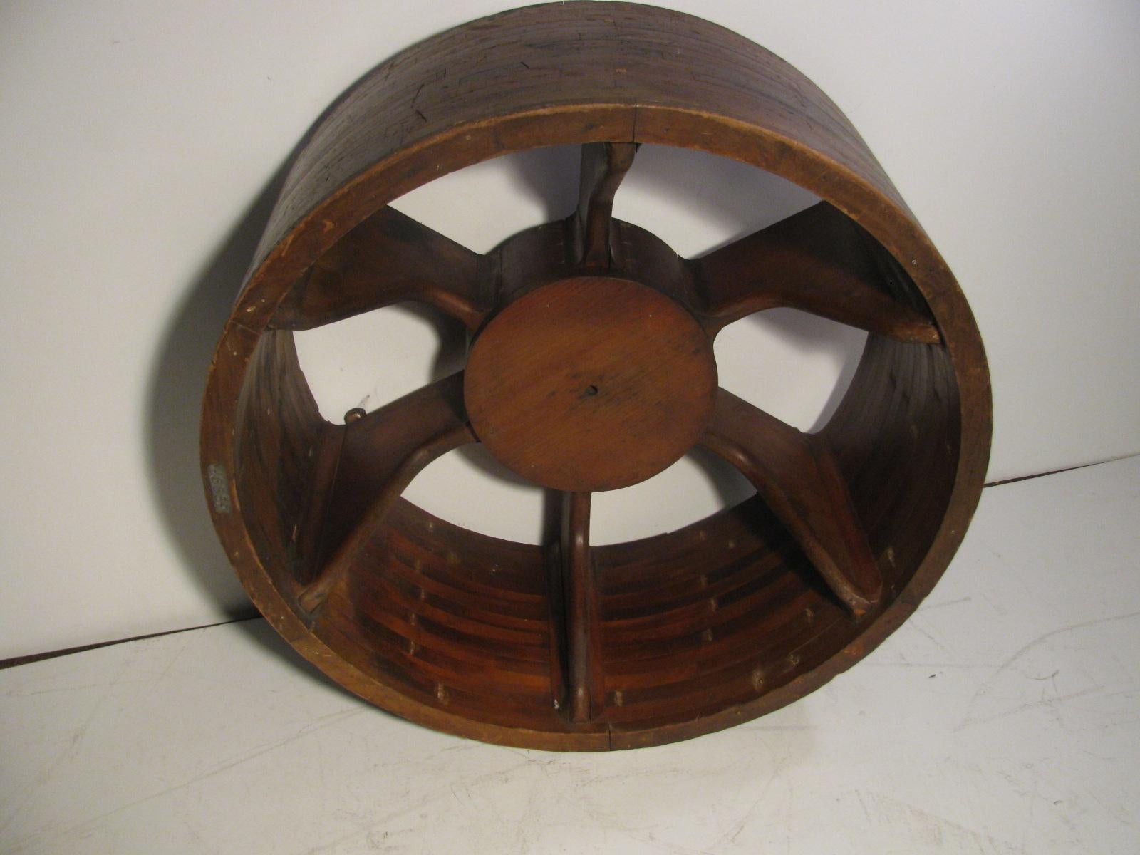 Antique architectural mold in the form of a wheel. All handmade and entirely intact. Can be hung on a wall for a unique piece of industrial sculpture or with a piece of glass on top used as a cocktail table. In excellent antique condition with