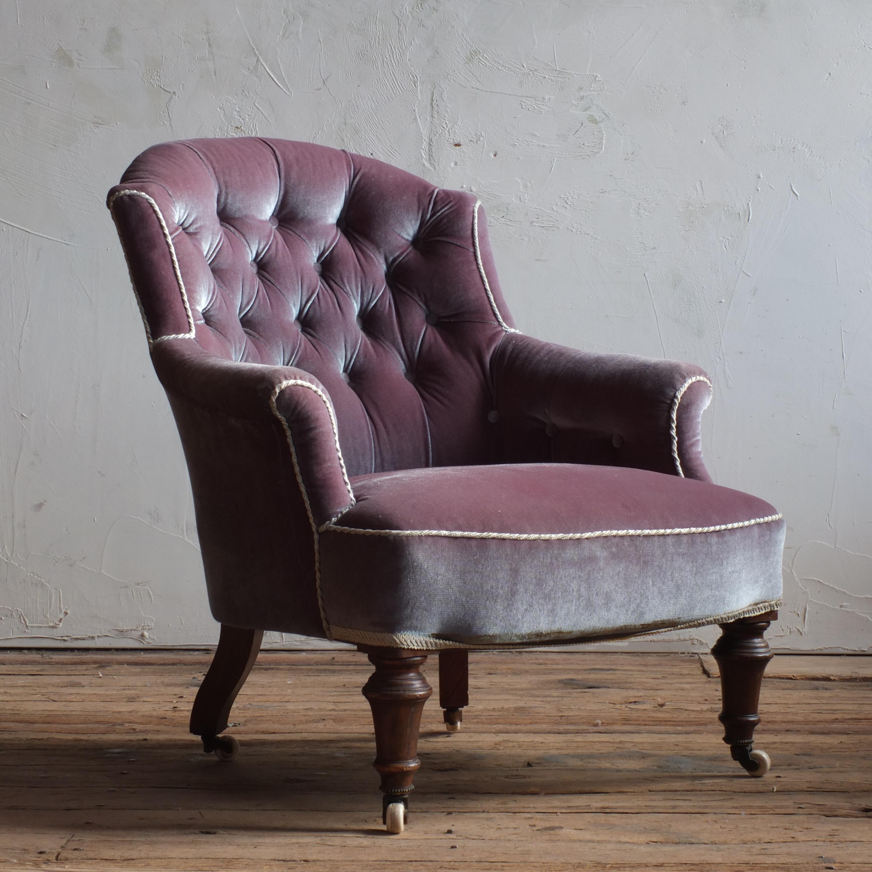 A good quality 19th century armchair raised on mahogany turned legs with the original white ceramic Cope & Collinson casters. In good structural condition but would benefit from upholstery. The upholstery is clean and very much usable though should