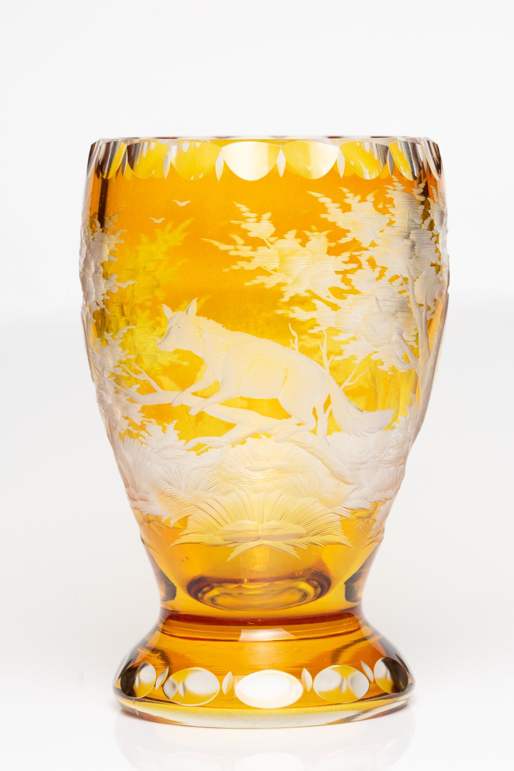 An impressive antique Bohemian Stained Glass Goblet/Vase depicts a fox in the centre on a tree branch among vegetation and spreading trees. This piece is engraved with beautiful and high-quality detail, especially the fox's body and tree's bark. The