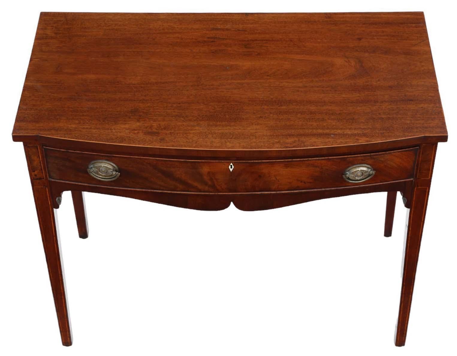 Antique 19th Century Bow Front Inlaid Mahogany Desk, serving as both a writing surface and dressing table, featuring a lovely classical late Georgian design.

This fine-quality piece exhibits no loose joints and is brimming with character and charm,
