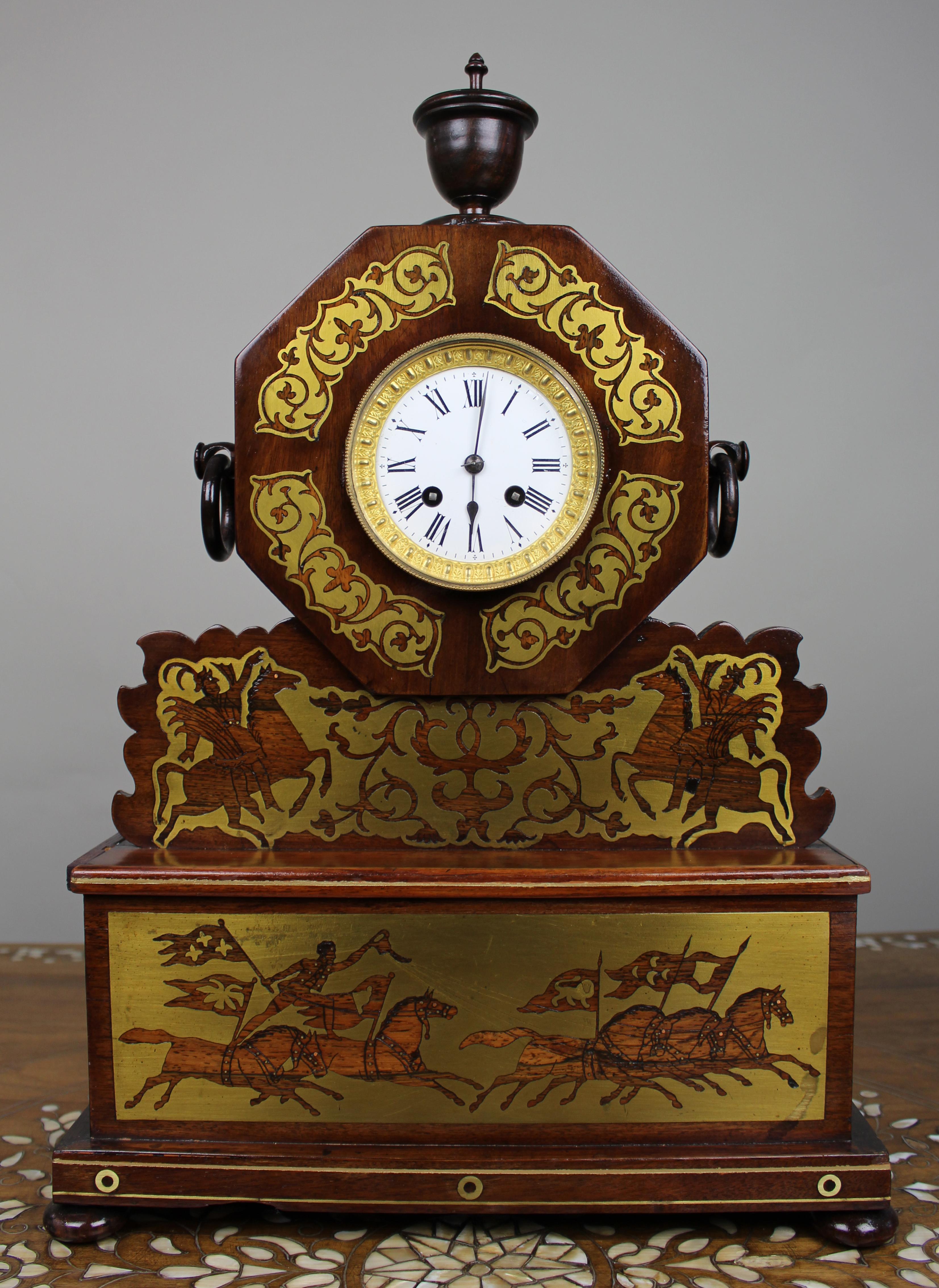 19th-Century French Mantel Clock with Brass Inlay Panels, c.1880

A decorative late 19th-century French mantel clock, the case crafted in stained hardwood and embellished with applied brass inlay. The octagonal dial housing is set above a