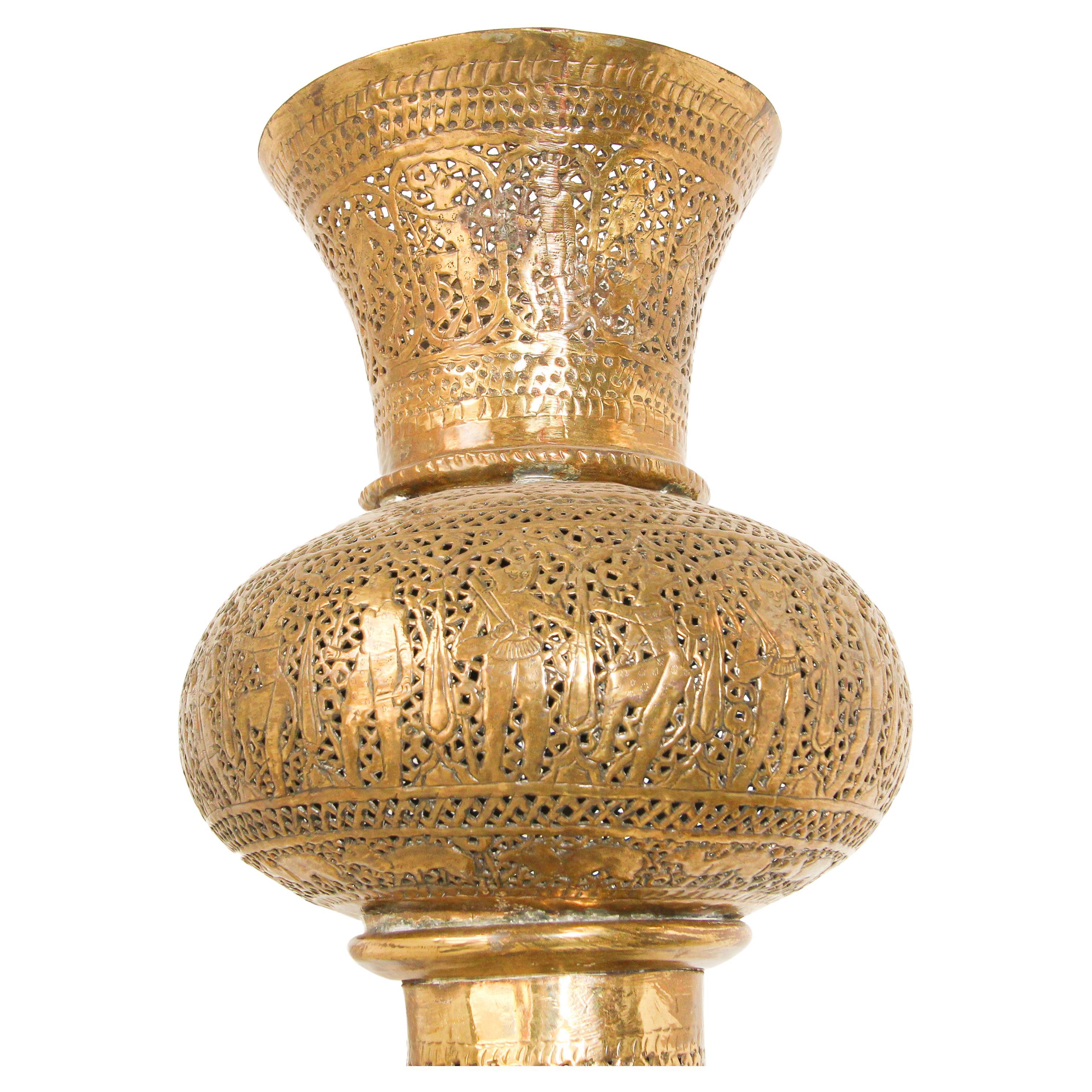 Extremely fine antique Islamic floor brass lamp with Kufic Mamluke revival pierced foliate openwork’s chased and chiselled with arabic calligraphy and figures.
Antique 19th century Middle Eastern Egyptian floor decorative candle lamp,
Rising from