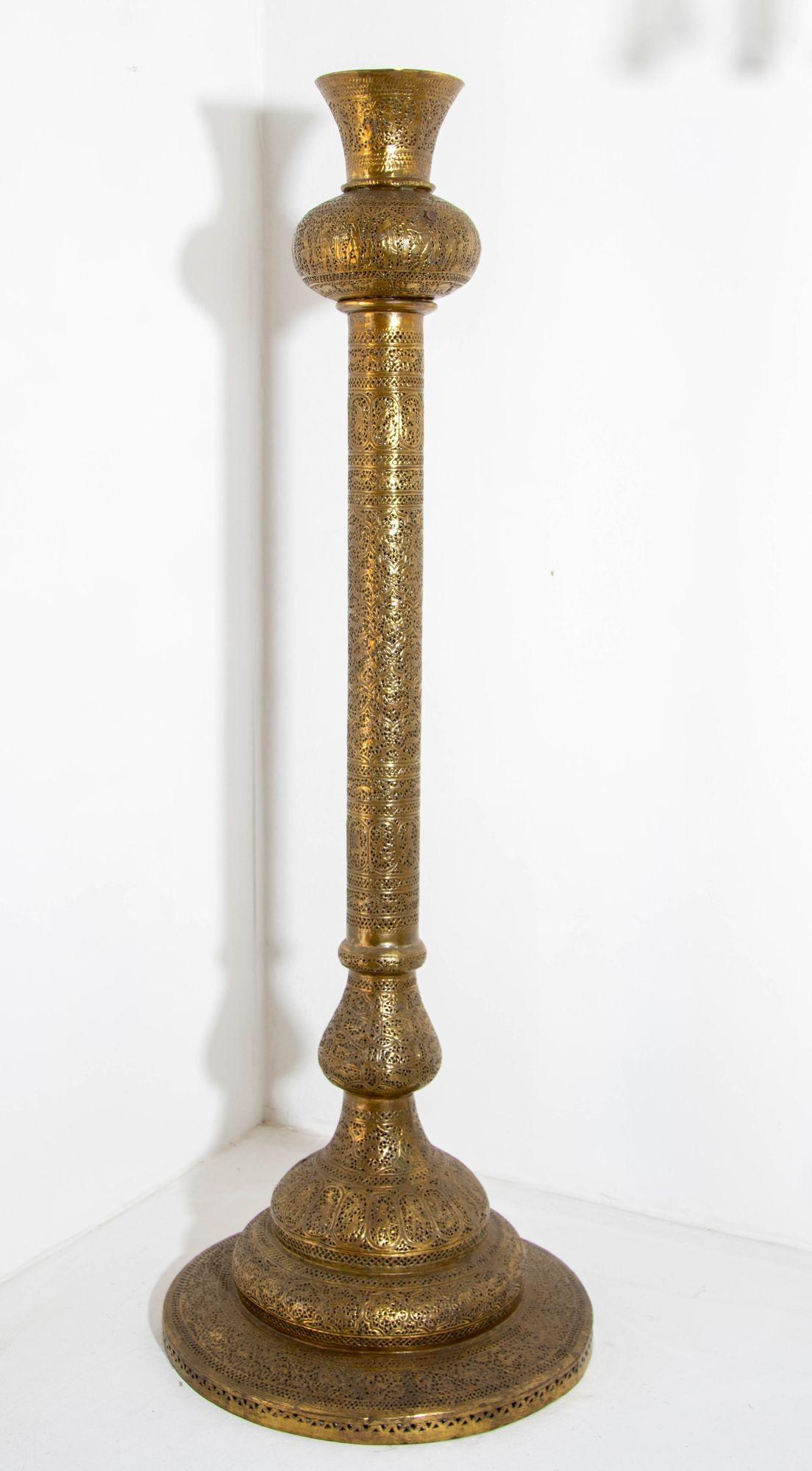 Extremely fine antique Islamic floor brass lamp with Kufic Mamluke revival pierced foliate openwork’s chased and chiselled with arabic calligraphy and figures.
Antique 19th century Middle Eastern Egyptian floor decorative candle lamp,
Rising from