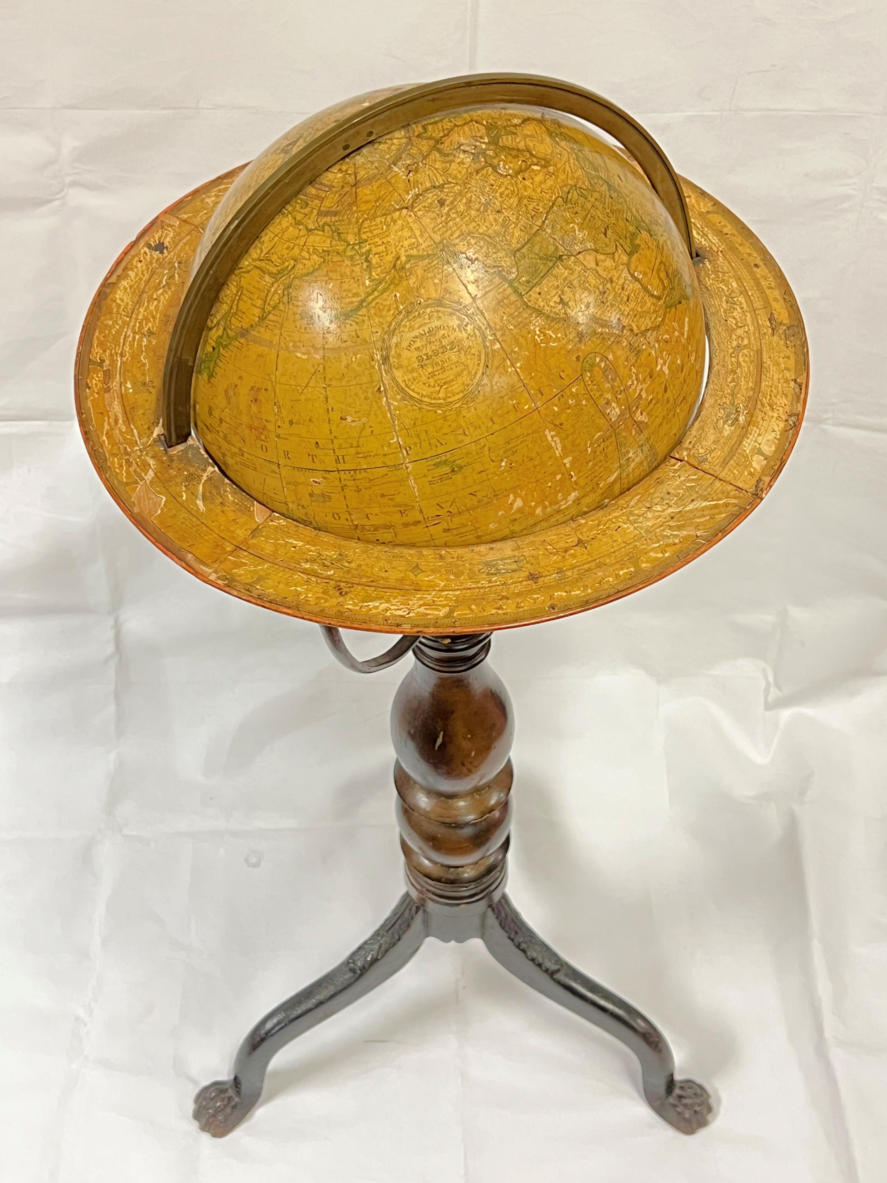 Antique (19th century) globe on stand issued in 1836 by Donaldson's of Edinburgh, Scotland, measuring 37 inches tall and 16 inches across.