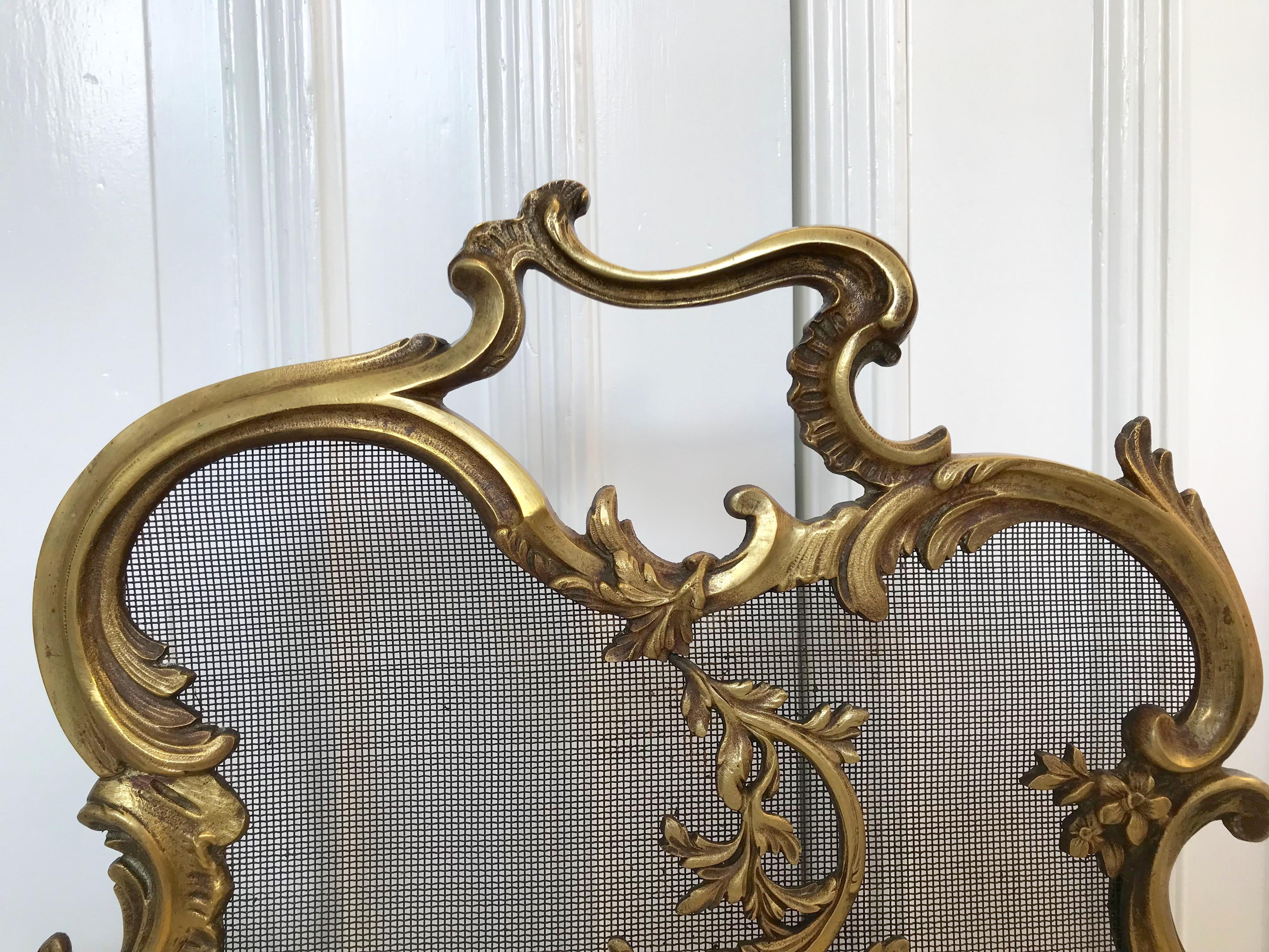 This Louis 15th style fire screen has amazing details and it is both marked and numbered.

If this beautifully handcrafted, 19th century firescreen is the right style to fit your fireplace and the size is correct for you as well then you could