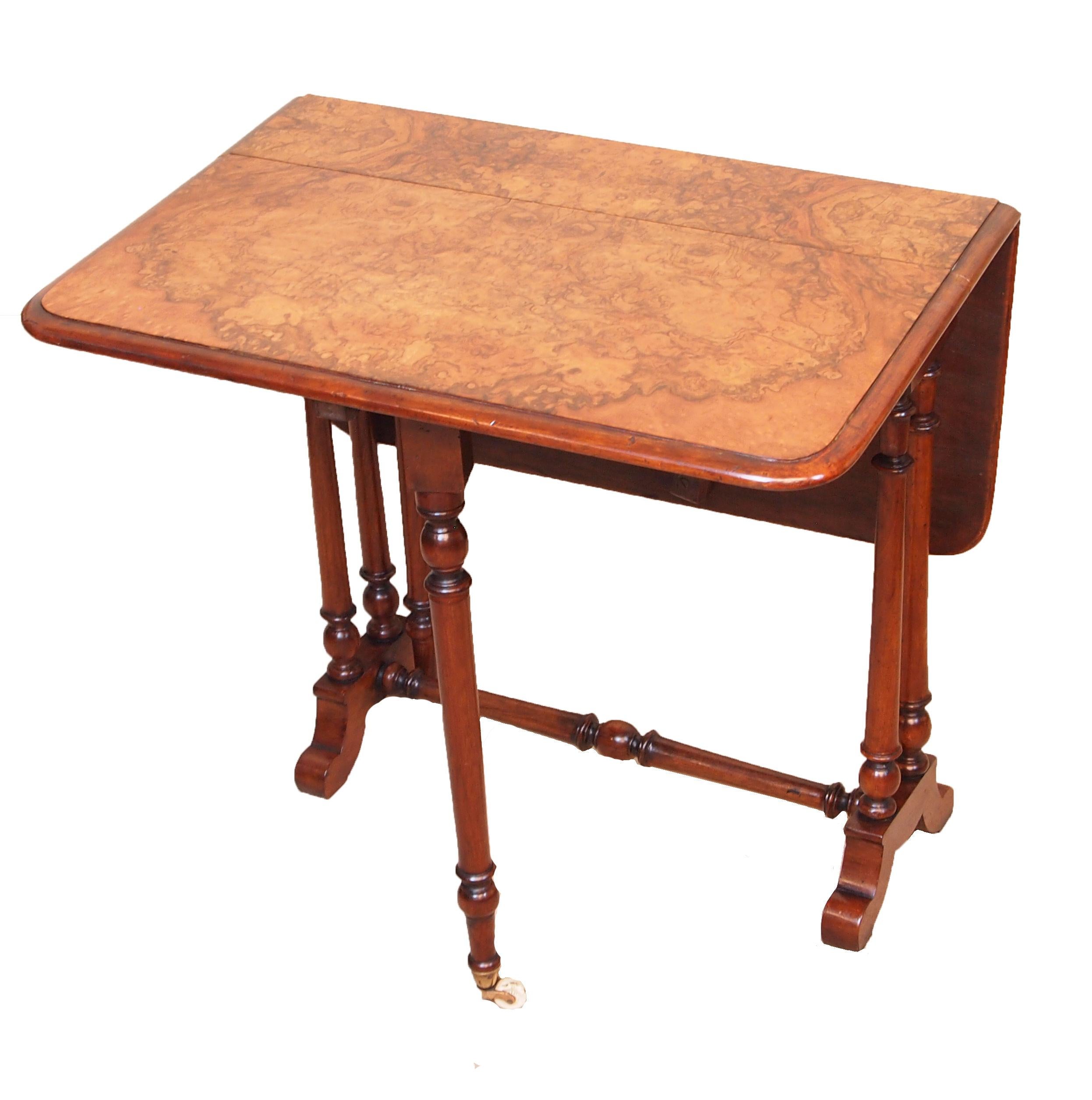 19th Century (1870s) English burled walnut baby Sutherland table with figured oblong top with two drop flaps raised on elegant turned upright supports

Height – 23.5in
Width – 6in (flaps down)
Width – 28.5in (flaps up)
Depth – 24in.