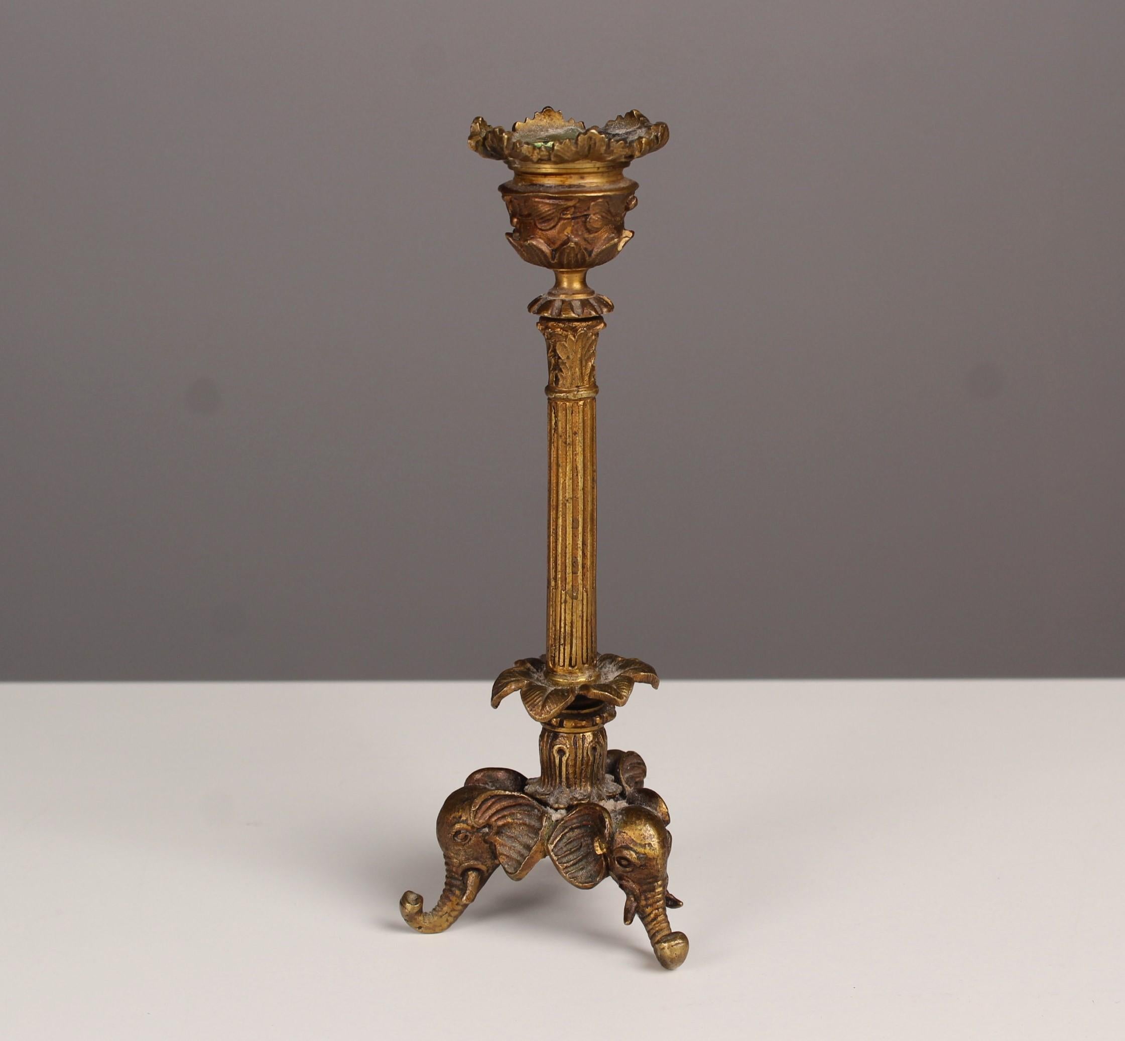 Beautiful antique candlestick with three stands in elephant head shape.
Nicely chiseled bronze work with several different floral ornaments.
Very nice age related condition.




