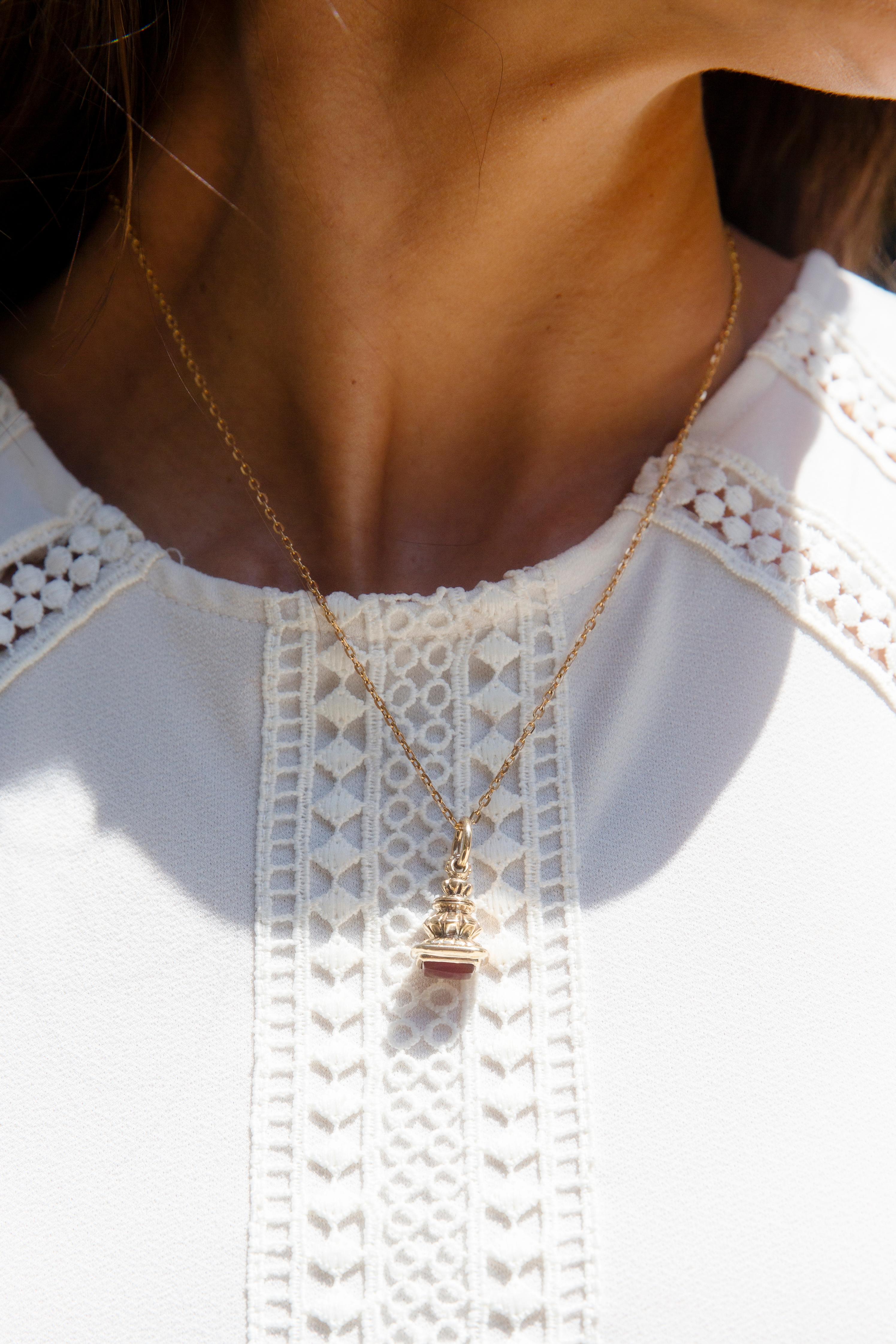 Crafted in the 19th century in 9 carat gold, The Jacinda Pendant is reminder of days gone by. Tiers of engraved gold, finished with rich carnelian creates a story that will be yours for years to come.

The Jacinda Pendant Gem Details
The rectangular