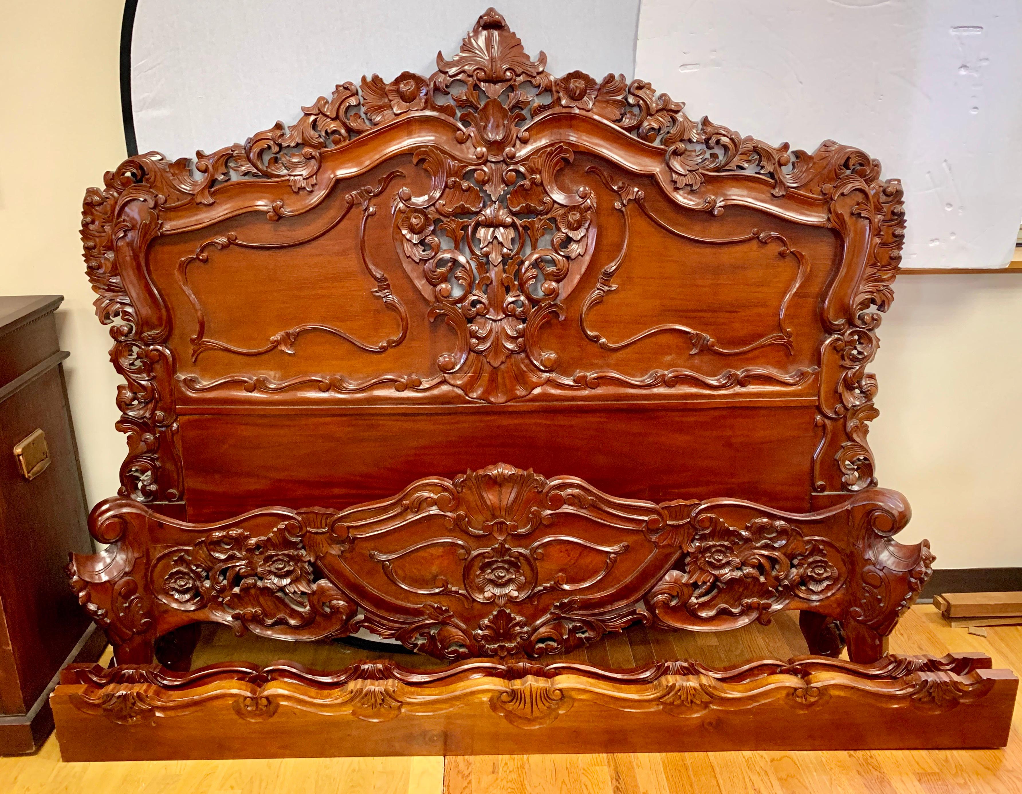 Antique French intricately carved queen size bed that comes with matching headboard, foot board and rails. What makes this queen bed exceptional is the carvings which need to be seen to appreciate. Mahogany and veneer.