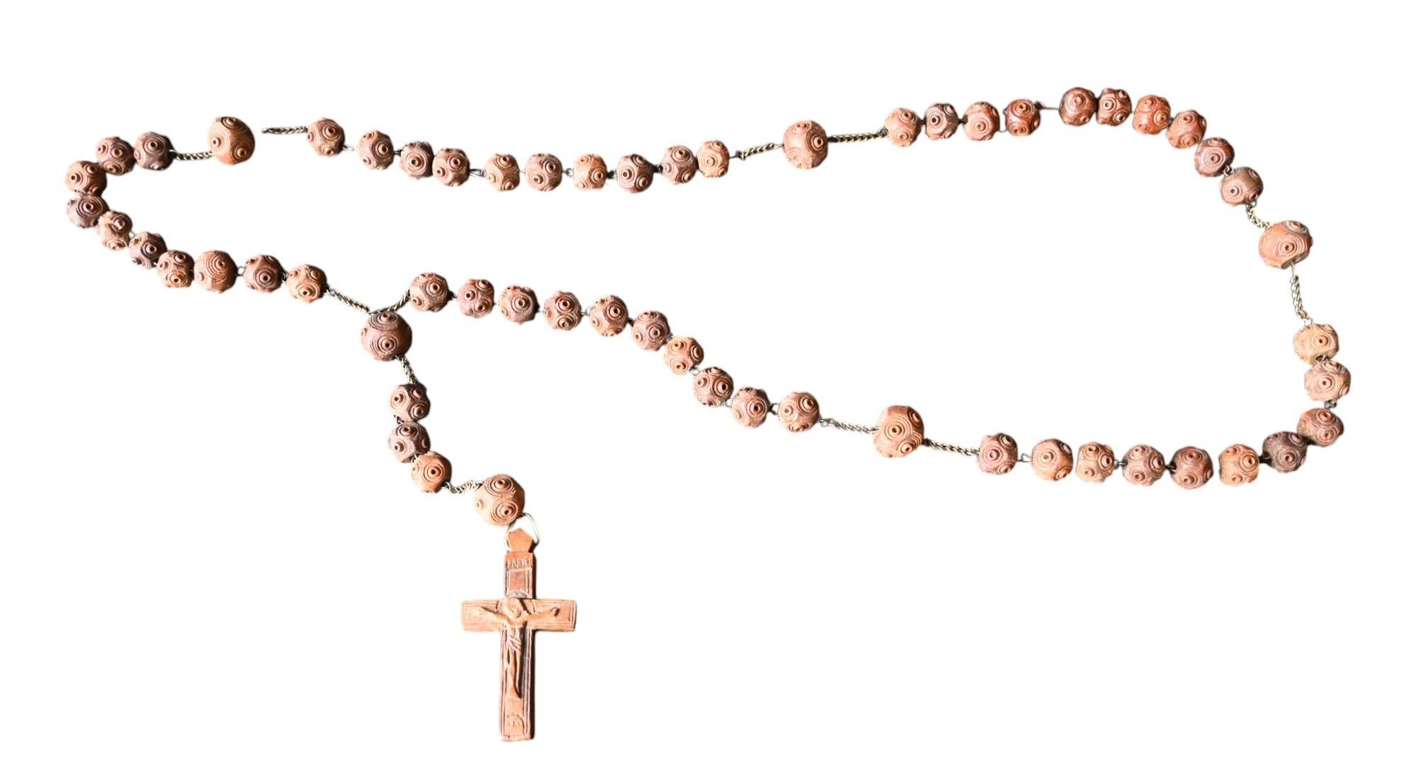 A rosary complete made from hardwood in the 19th century
each ball is decorated with turned cirkels and have a diameter between 1 and 1.5 cm
The cross is 6.5 x 3.5 cm

