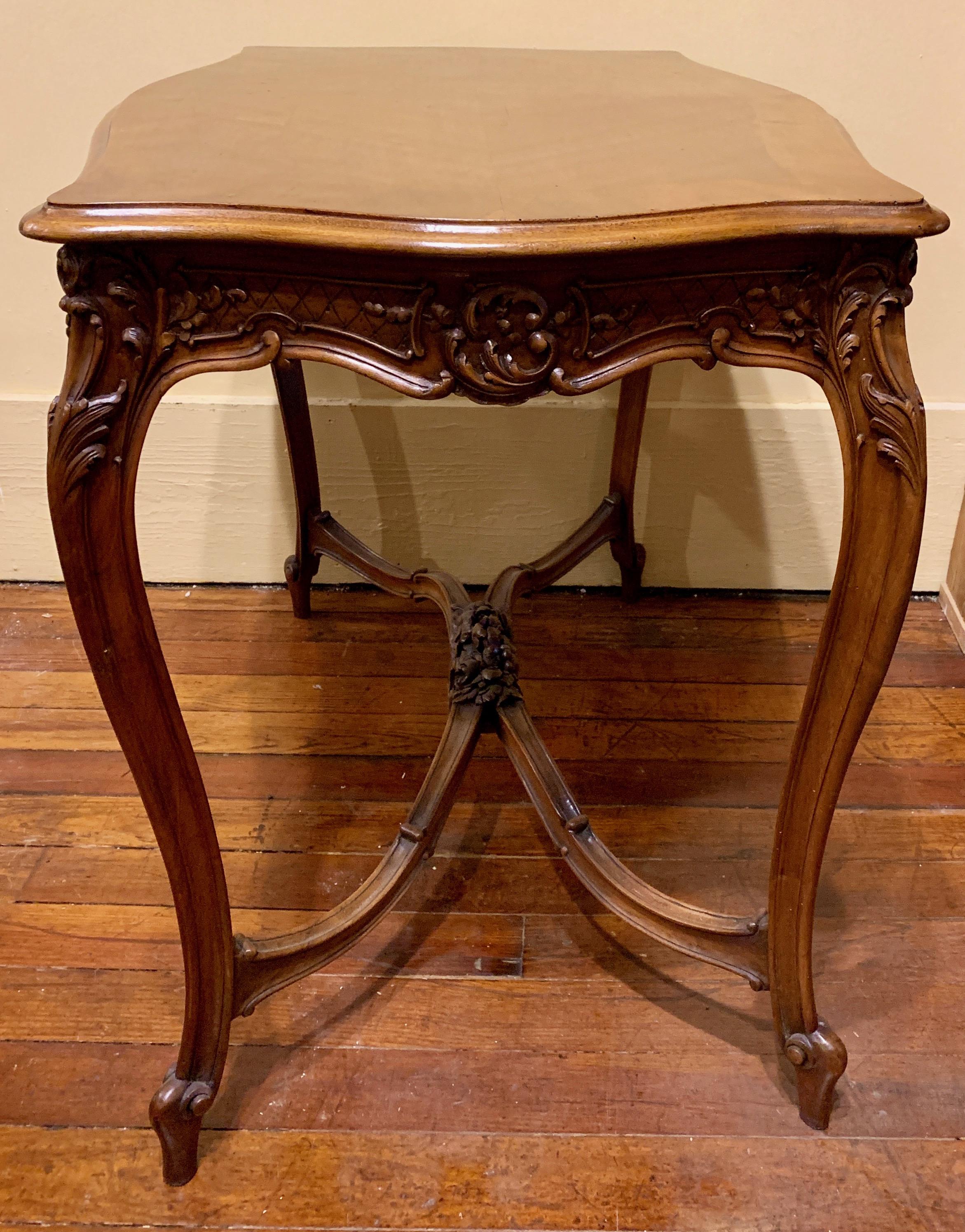 A pretty table with handsome carved elements and of a nice size, too.
 