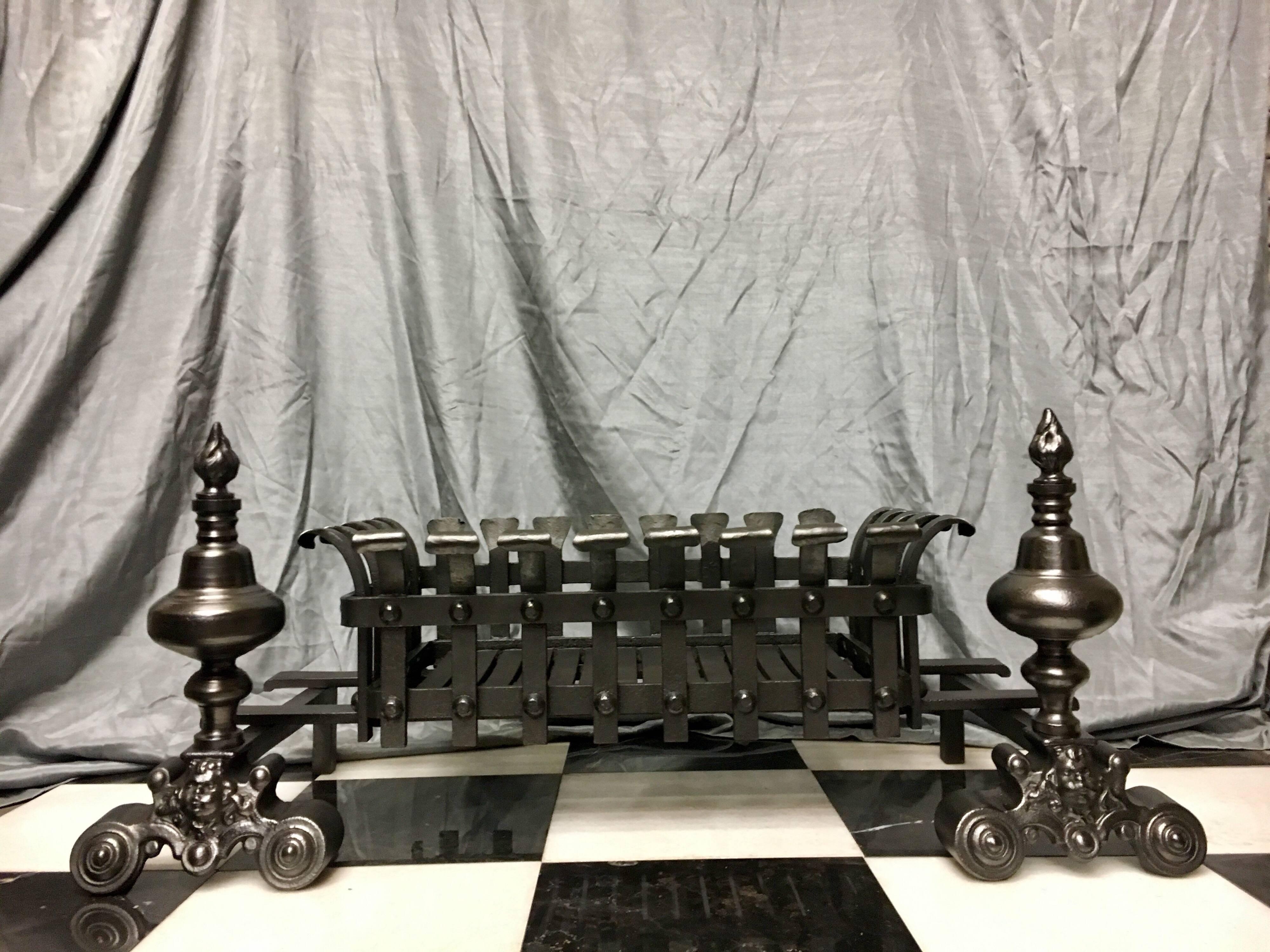 A large antique 19th century cast and wrought Iron fire basket grate in the Baroque manor, this piece may be moved in or out to different widths to accommodate various chamber openings. Salvaged originally from Pilrig House, Edinburgh, Scotland- the