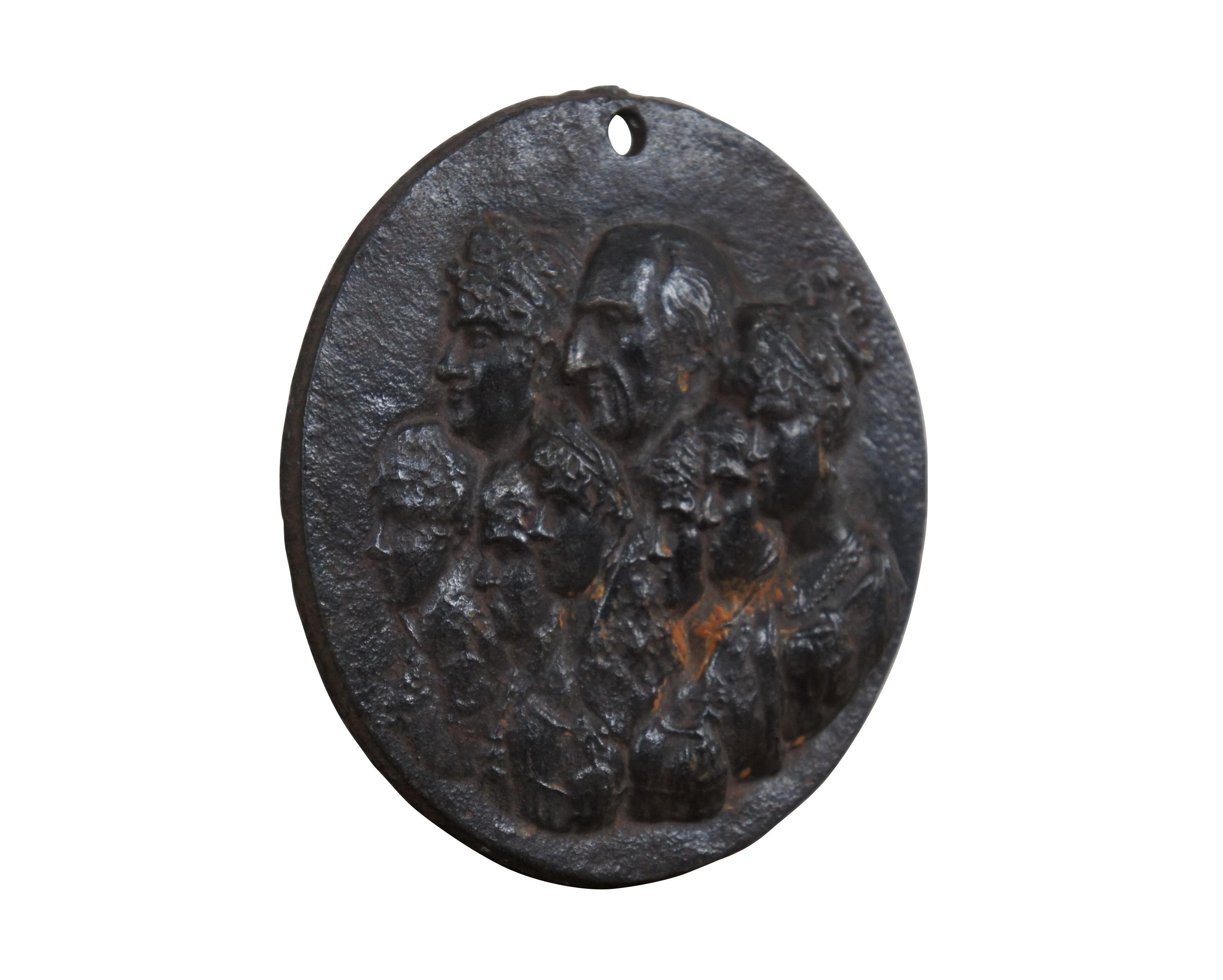 Circa 19th century cast iron medallion / wall plaque depicting a portrait of King Charles IV of Spain and his family. The group portrait shows King Charles IV, Queen Maria Luisa of Parma and five of their children - Carlota Joaquina, Maria Luisa,