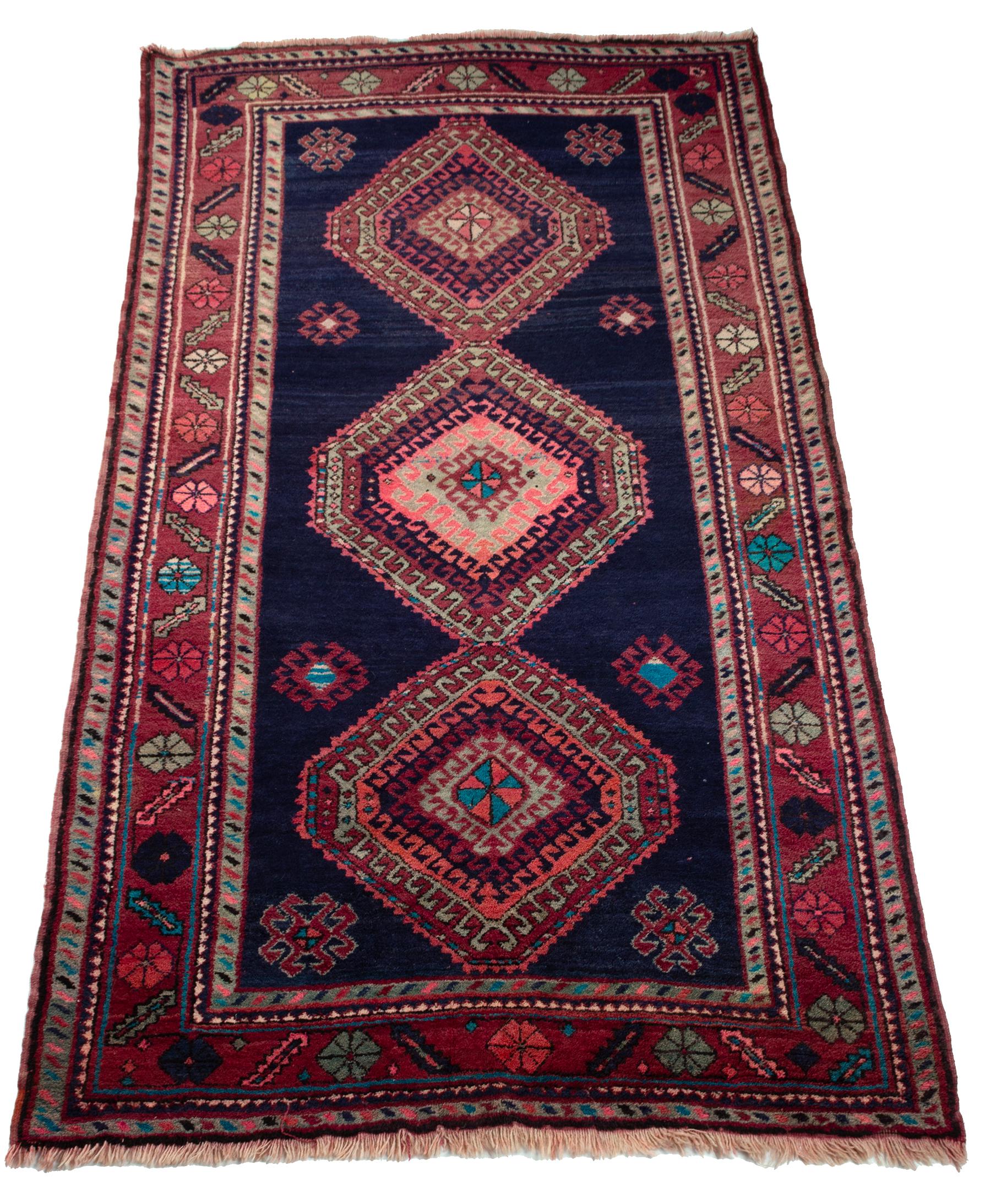 A Caucasian Kazak rug

A Caucasian Kazak rug,
decorated with three central medallions to a navy field, and red borders,

Measures: 261cm x 148cm

In good condition commensurate with age.