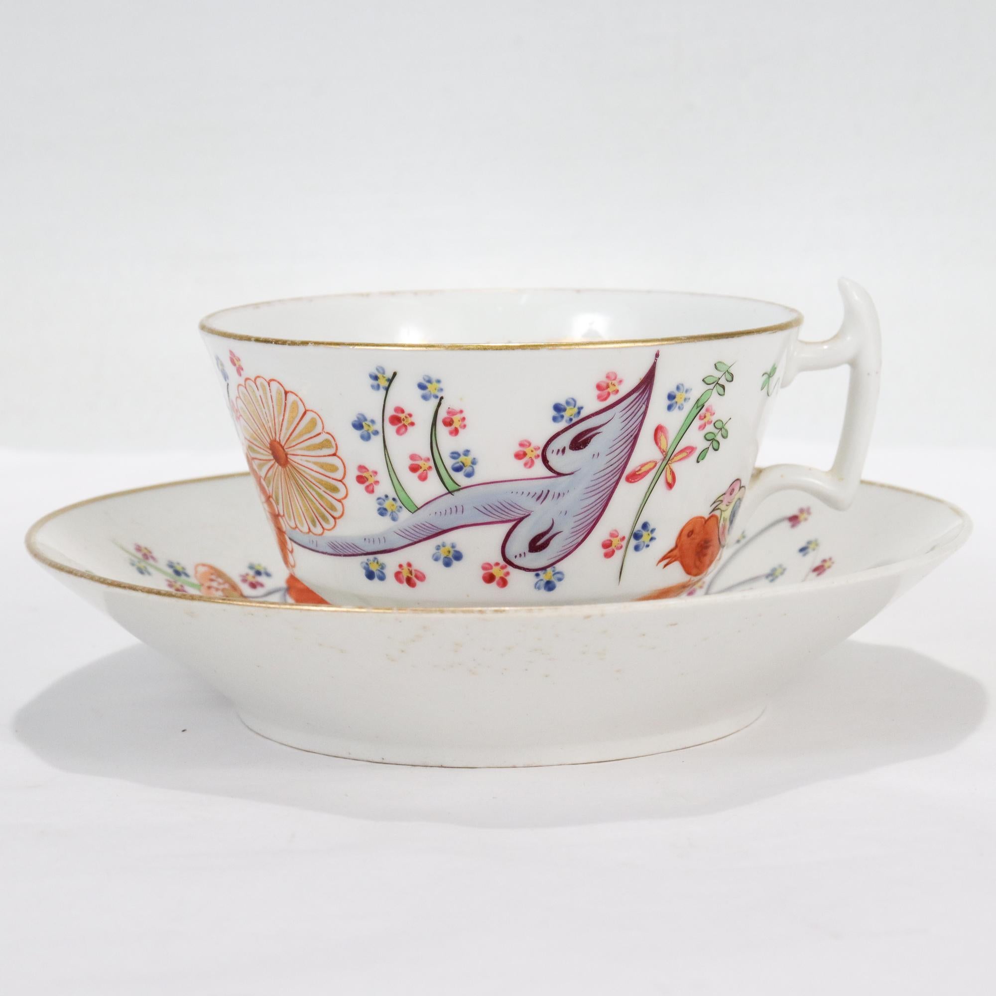 A fine antique English porcelain cup & saucer.

In the Quail pattern. 

By Chamberlain Worcester.

With painted green, blue, and red painted floral decoration with a pair of quails.

Both cup and saucer have gilt rims & highlights.

Simply