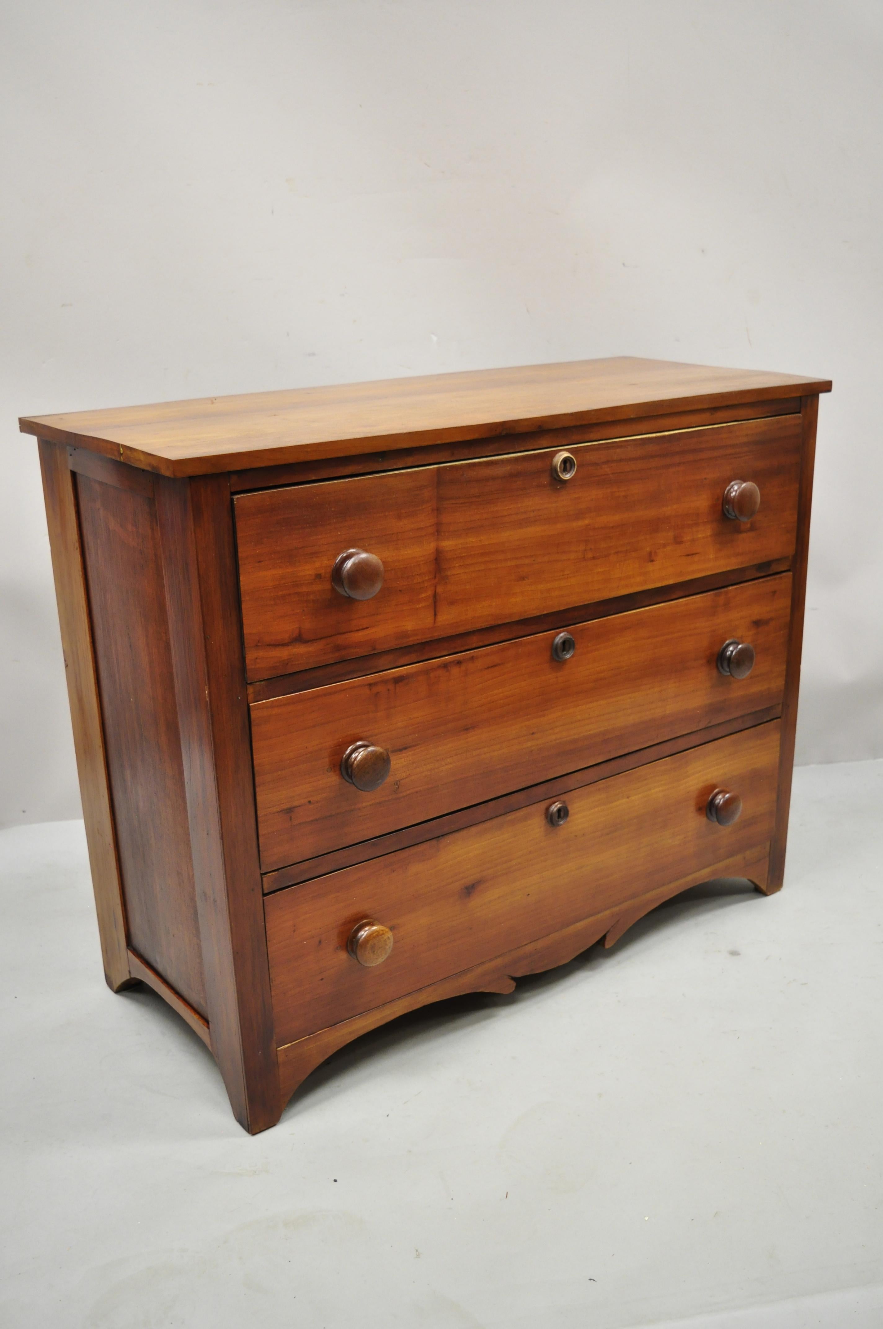Antique 19th century cherry wood three drawer Colonial Primitive dresser chest. Item features solid wood construction, beautiful wood grain, no key, but unlocked, 3 drawers, very nice antique item, quality American craftsmanship, great style and