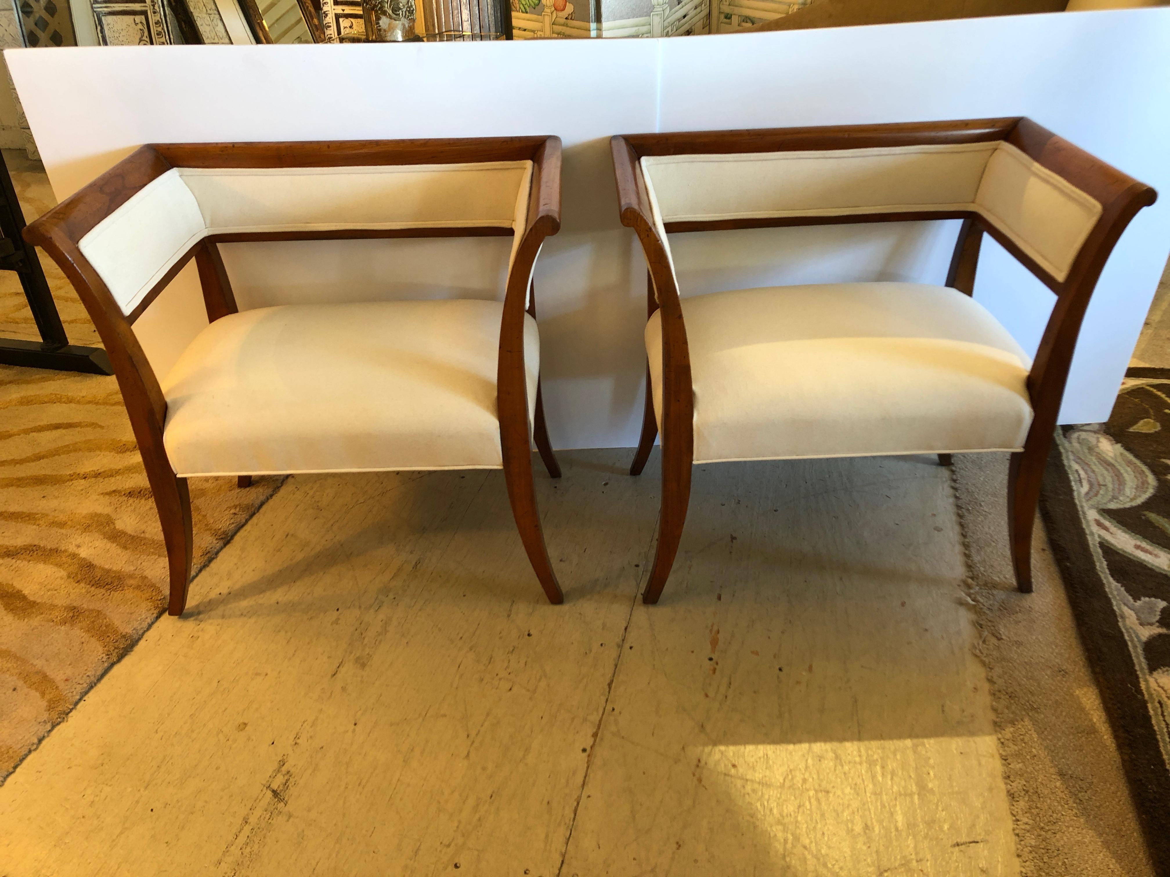 Super chic pair of Directoire style chairs or benches having fruitwood frames with elegant splayed legs and square backs, newly upholstered in heavy white cotton duck.