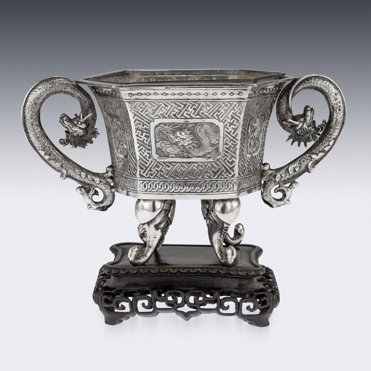 Antique late 19th century Chinese very unusual solid silver and glass jardinière, of hexagonal form, applied with unusual twin dragon handles and standing on elephant head supports, sides decorated with transparent cross-key pattern and each side