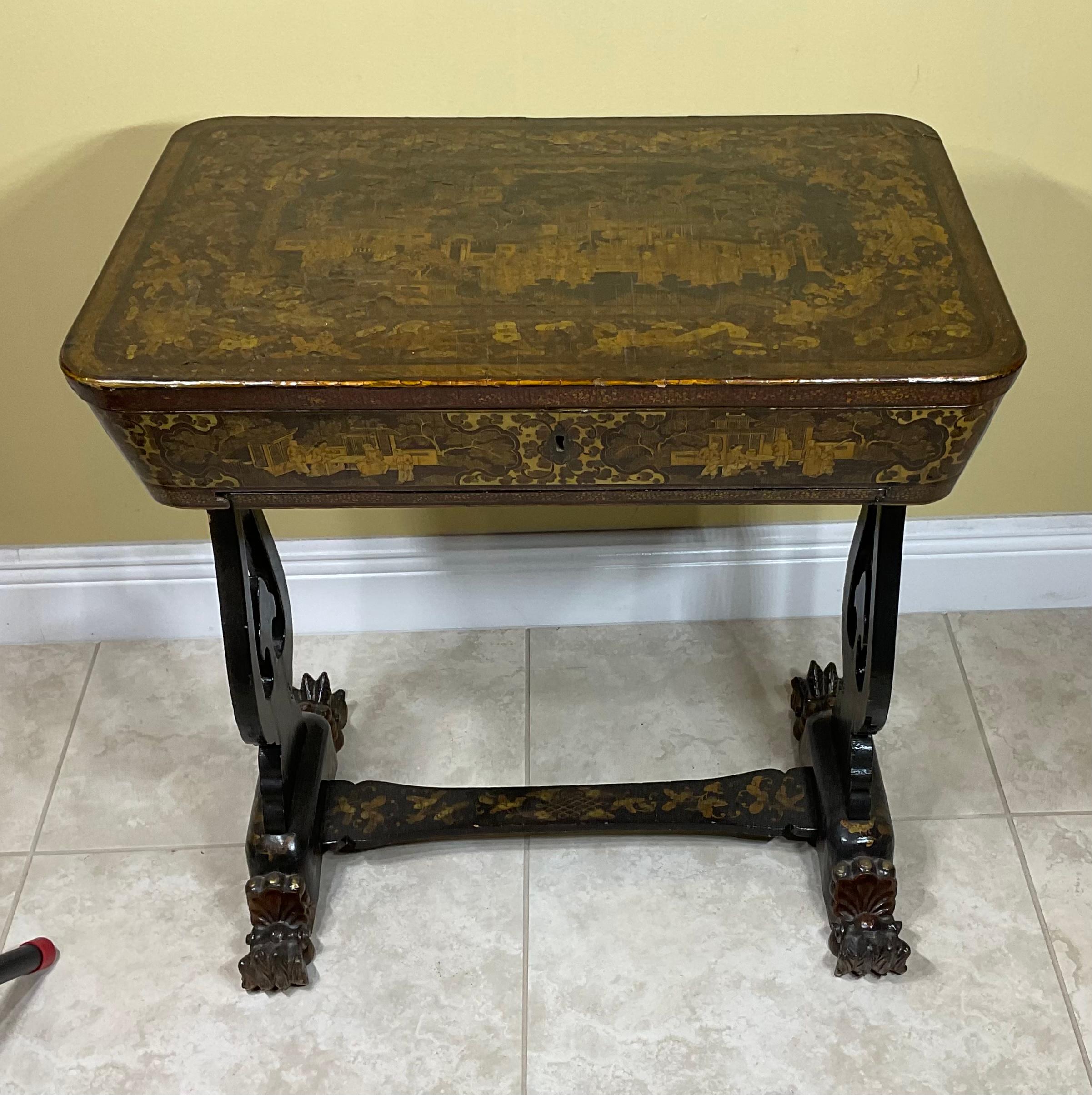 Beautiful antique 19th century Chinese lacquer sewing table with hand painted vivid scenes, decorative hand carved and painted legs, open top table show hand painted compartments for threads and needles storage. Exceptional gilt export black lacquer