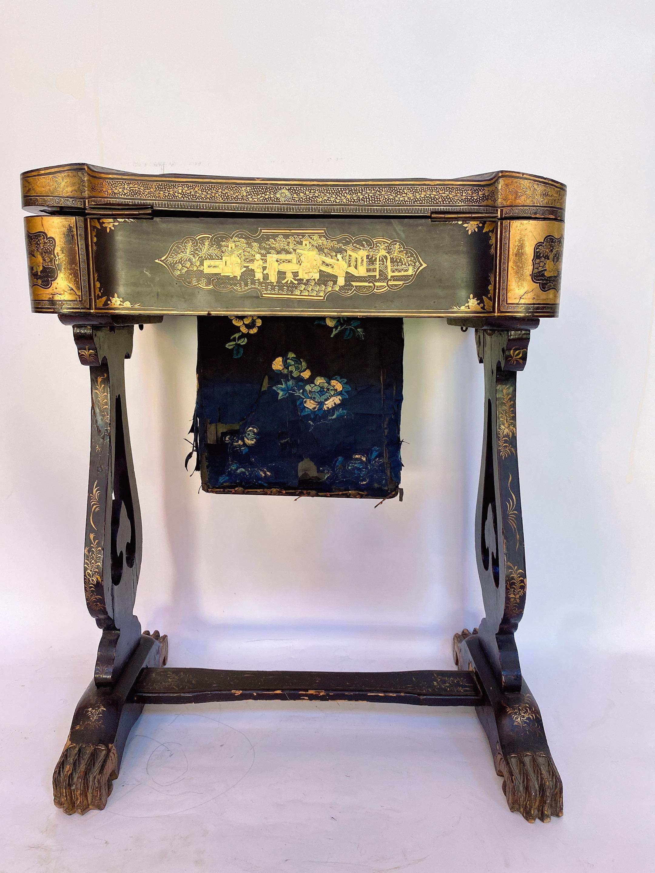 Antique 19th century Chinese lacquer sewing table with hand painted scenes and beautiful legs. Gilt export black lacquer all-over the table. see more photos . 