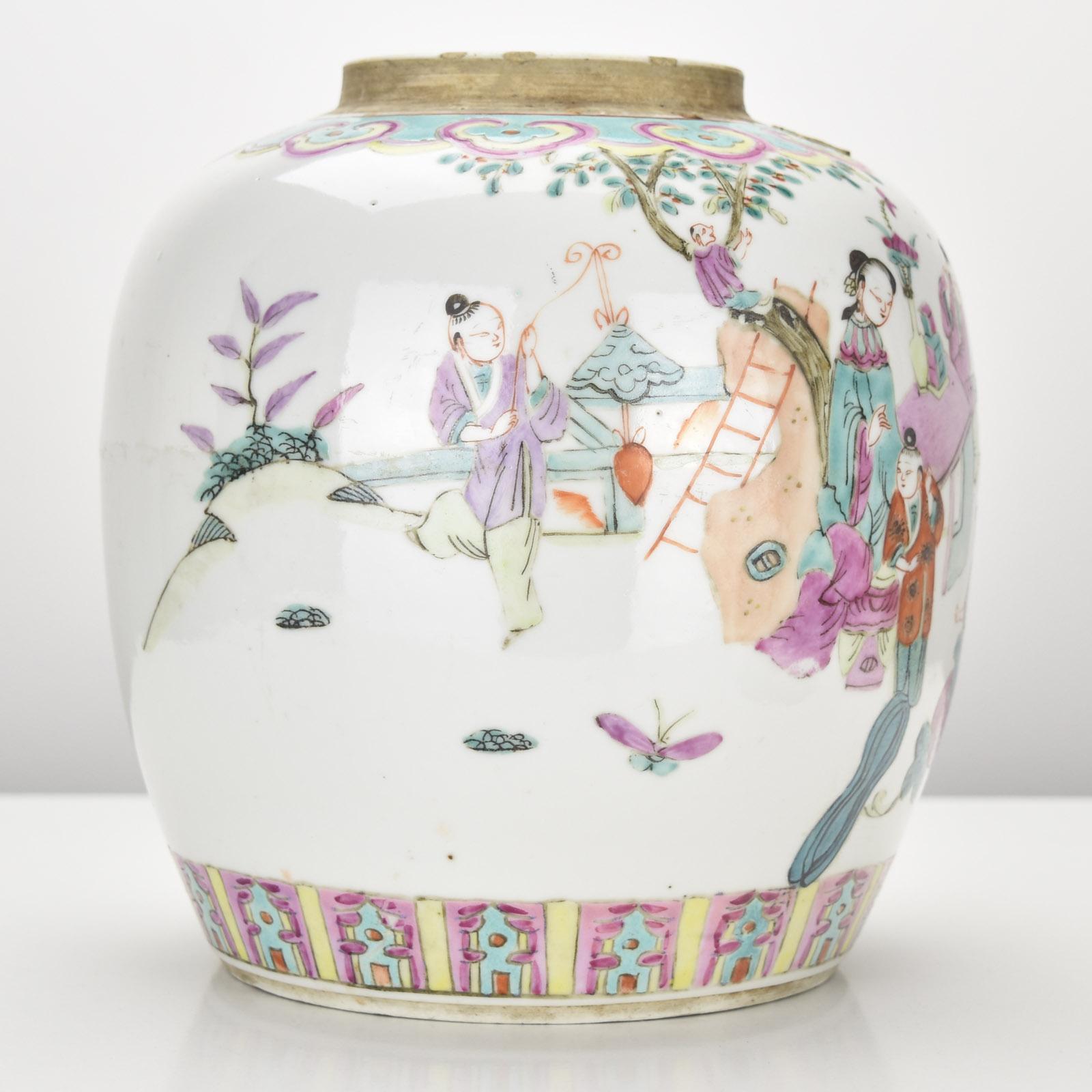 This antique Chinese ginger jar, from the Qing Dynasty, is beautifully decorated in the Famille Rose palette, known for its delicate pinks, greens, and intricate detailing. The jar depicts traditional scenes with figures engaged in daily activities,