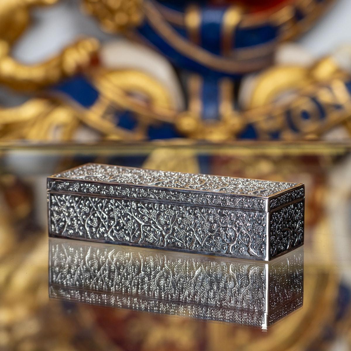 Antique 19th Century Chinese export solid silver box, of elongated rectangular form, decorated with stunning repousse decoration cherry blossom pattern. Hallmarked Chinese Export silver (acid tested shows a 900+ silver standard), Artisan mark Liang