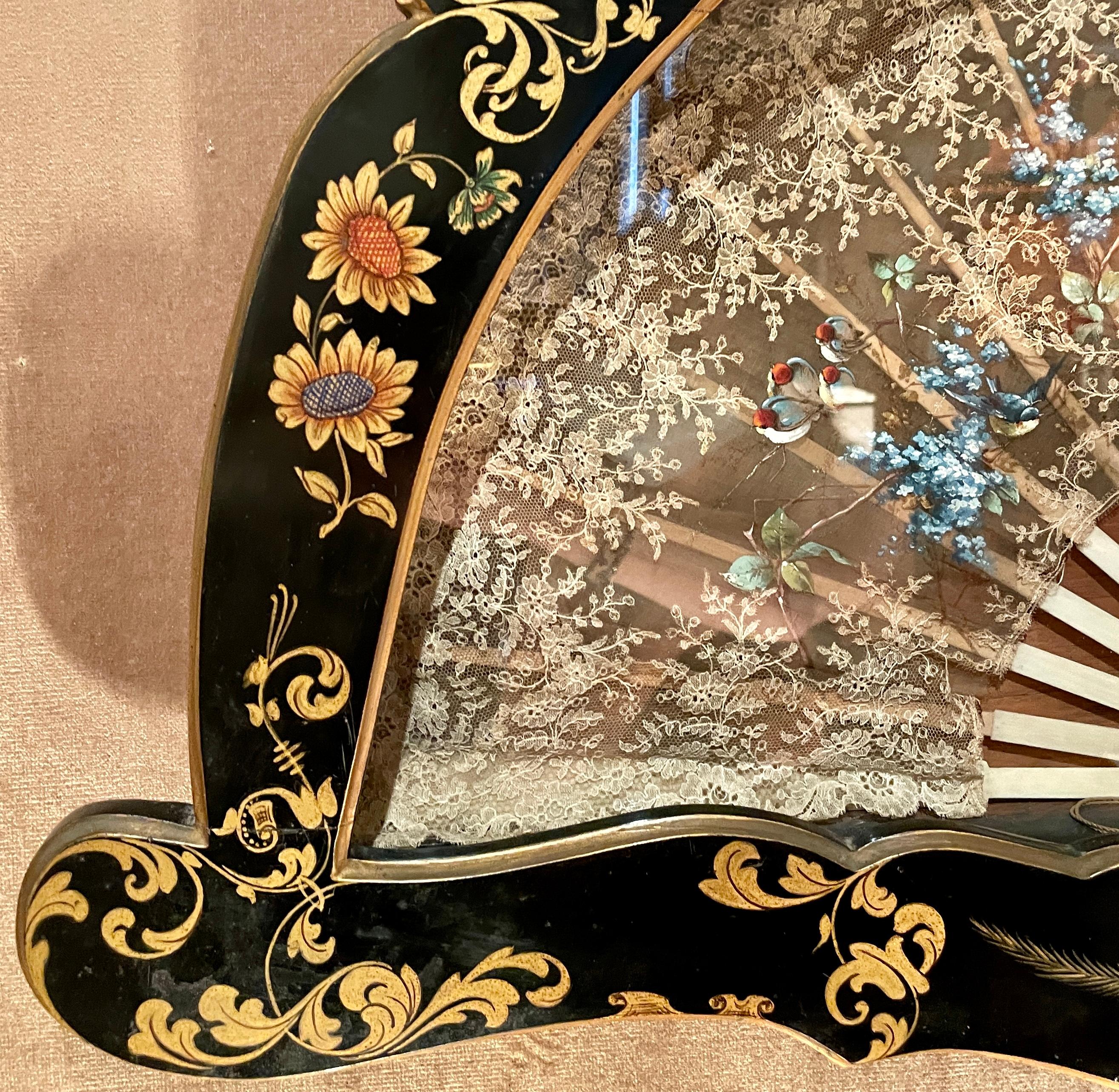 Antique 19th century Chinoiserie hand-made fan in a lacquered frame, circa 1870.