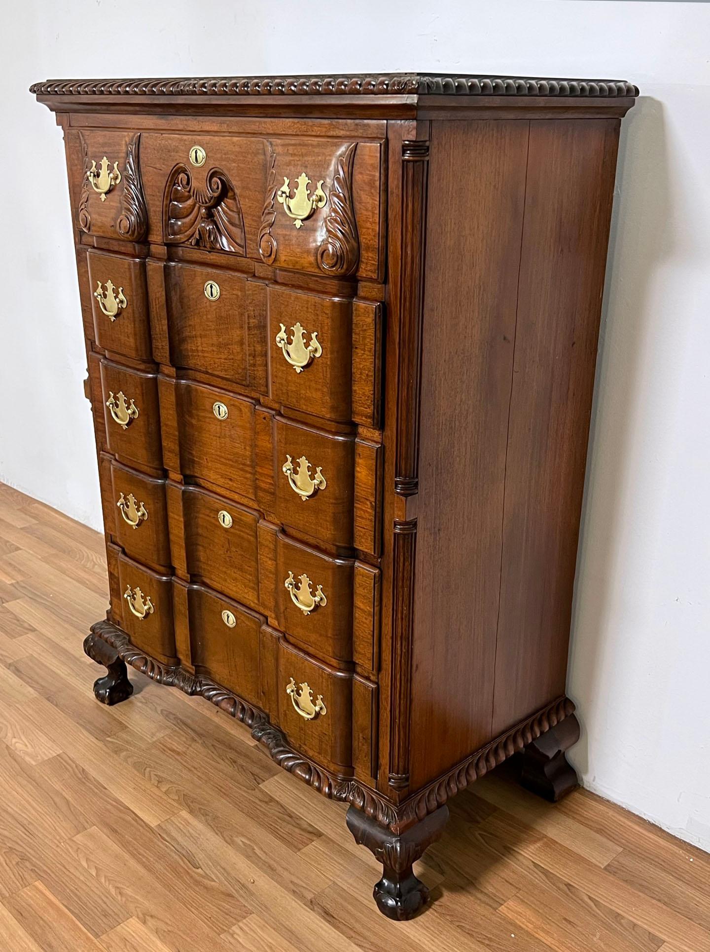 Early to mid 19th century Chippendale block front tall chest of five drawers in solid mahogany. Features its original batwing brasses and upper and lower gadrooned moldings.