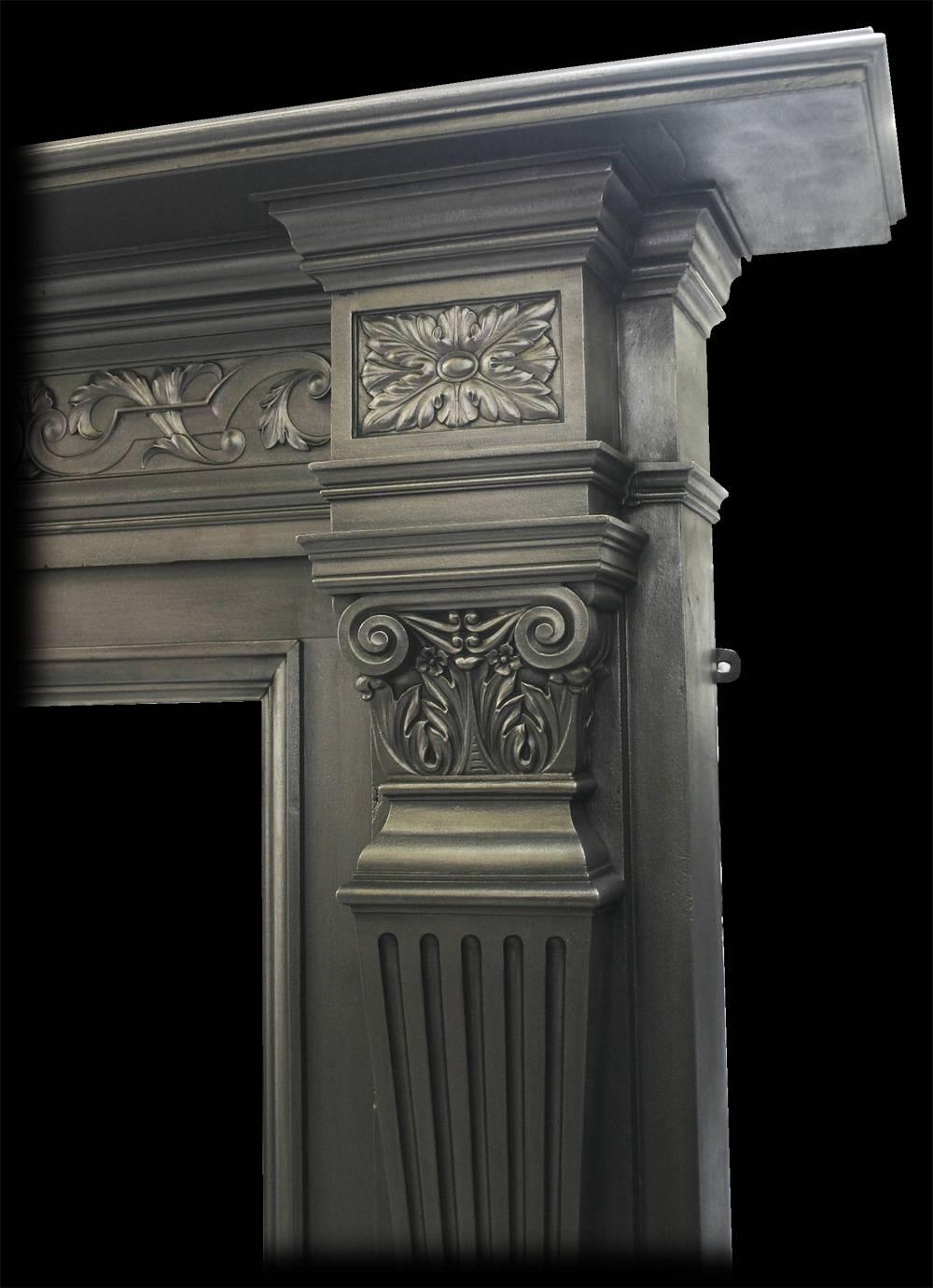 Large and imposing antique Victorian cast iron fire surround by the Coalbrookdale Foundry. With tapering fluted pilasters terminating in acanthus and scroll capitals below corner capitals with cast paterae, either side of further acanthus leaves and