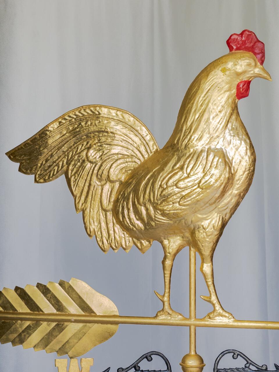 This 19th-century American rooster weathervane boasts intricate craftsmanship, with brass finish over copper, a testament to the era's skilled artisans. Standing proudly atop its directional rod, the rooster's detailed feathers and bold stance