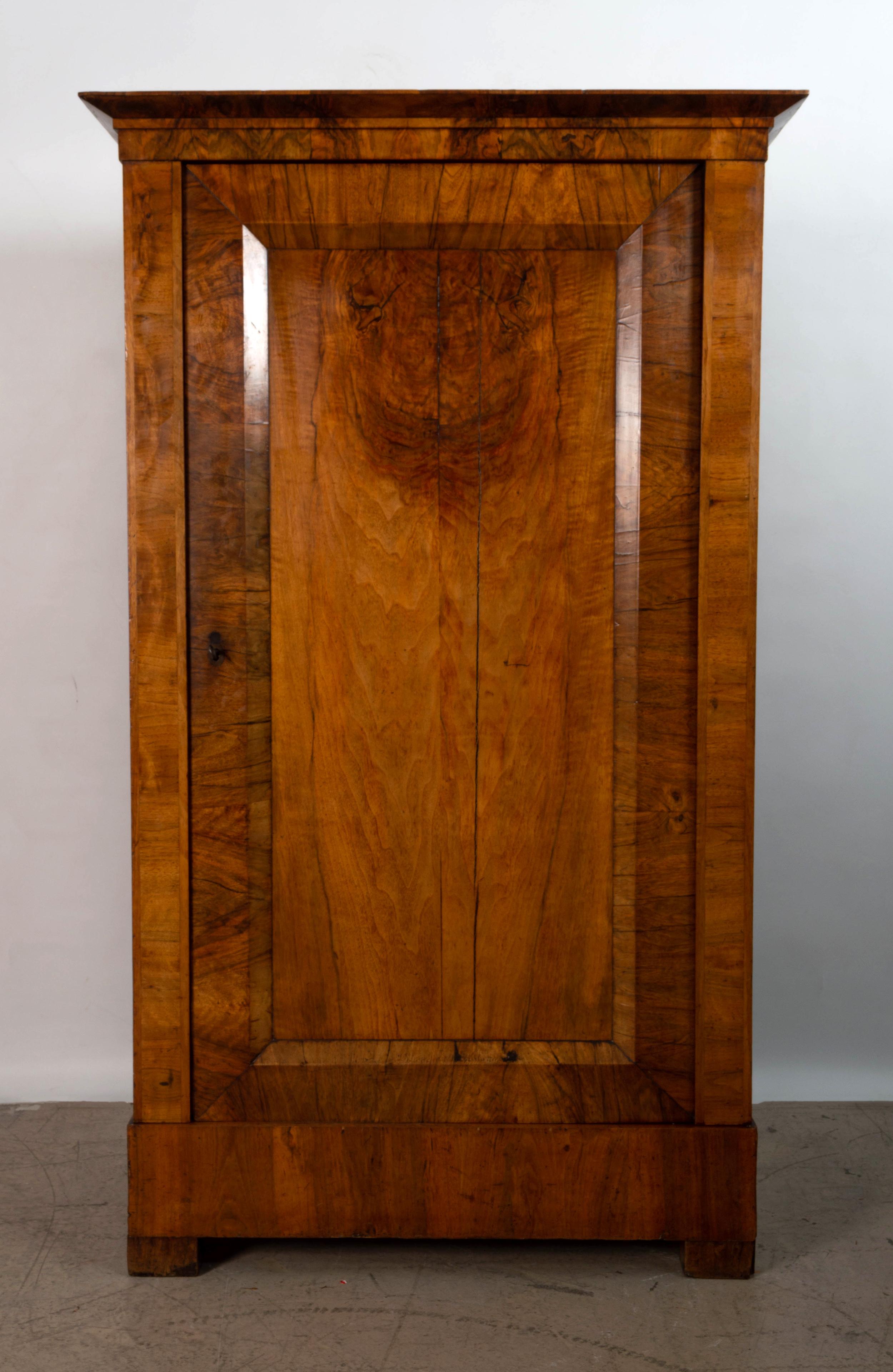 Antique 19th Century Danish Figured Walnut Cabinet Cupboard C.1860

A Danish panelled single door cabinet. Constructed from the most striking figured walnut.

The interior fitted for shelving, over a base drawer, on block feet.
Beautiful warmth