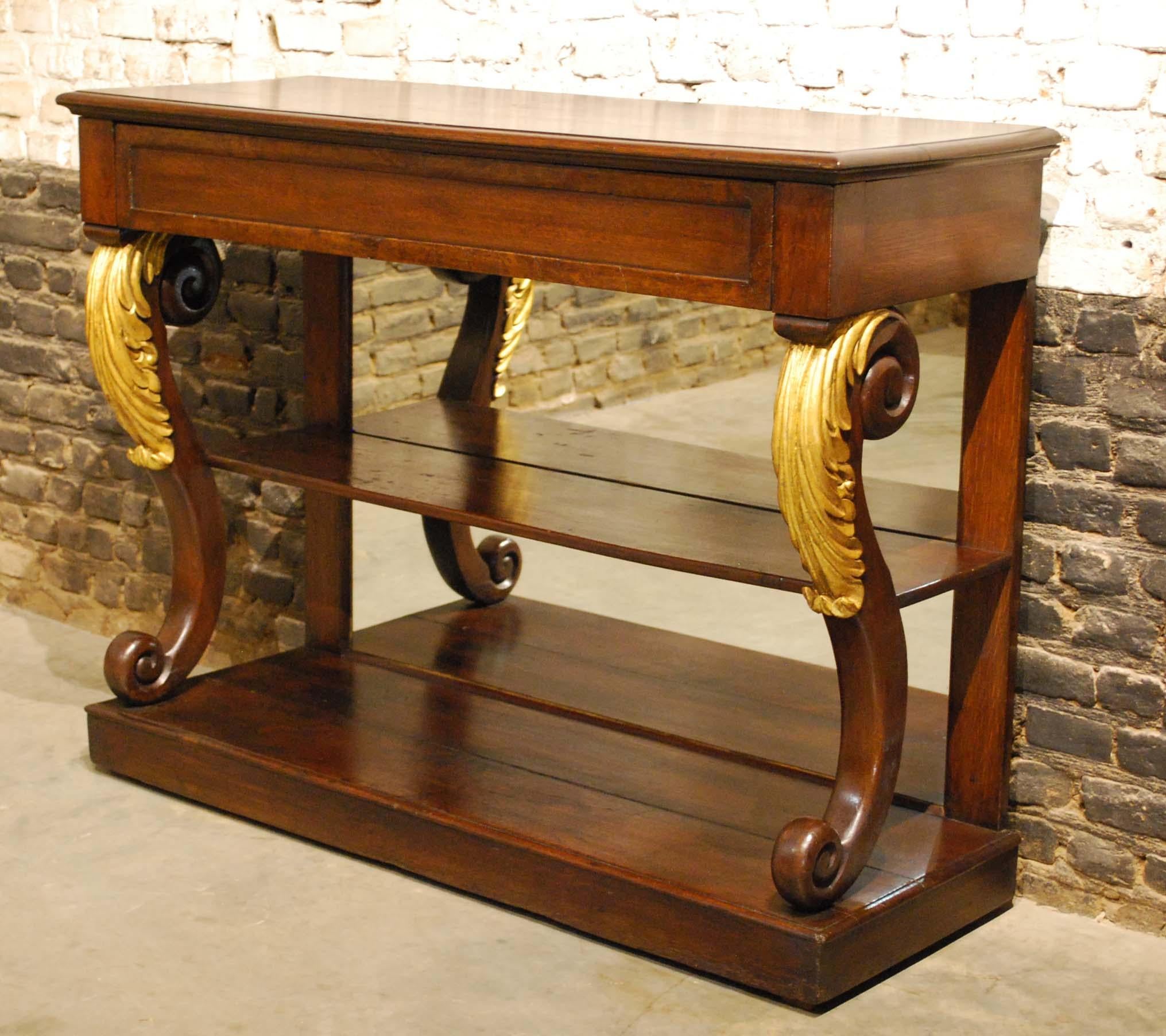 This elegant Empire sideboard was made in the Netherlands in the early 1800s and is also known as trumeau.
It was made in the finest quality watered oak and has a beautiful crossband bur walnut veneer surrounding the drawer. The S-shaped front legs