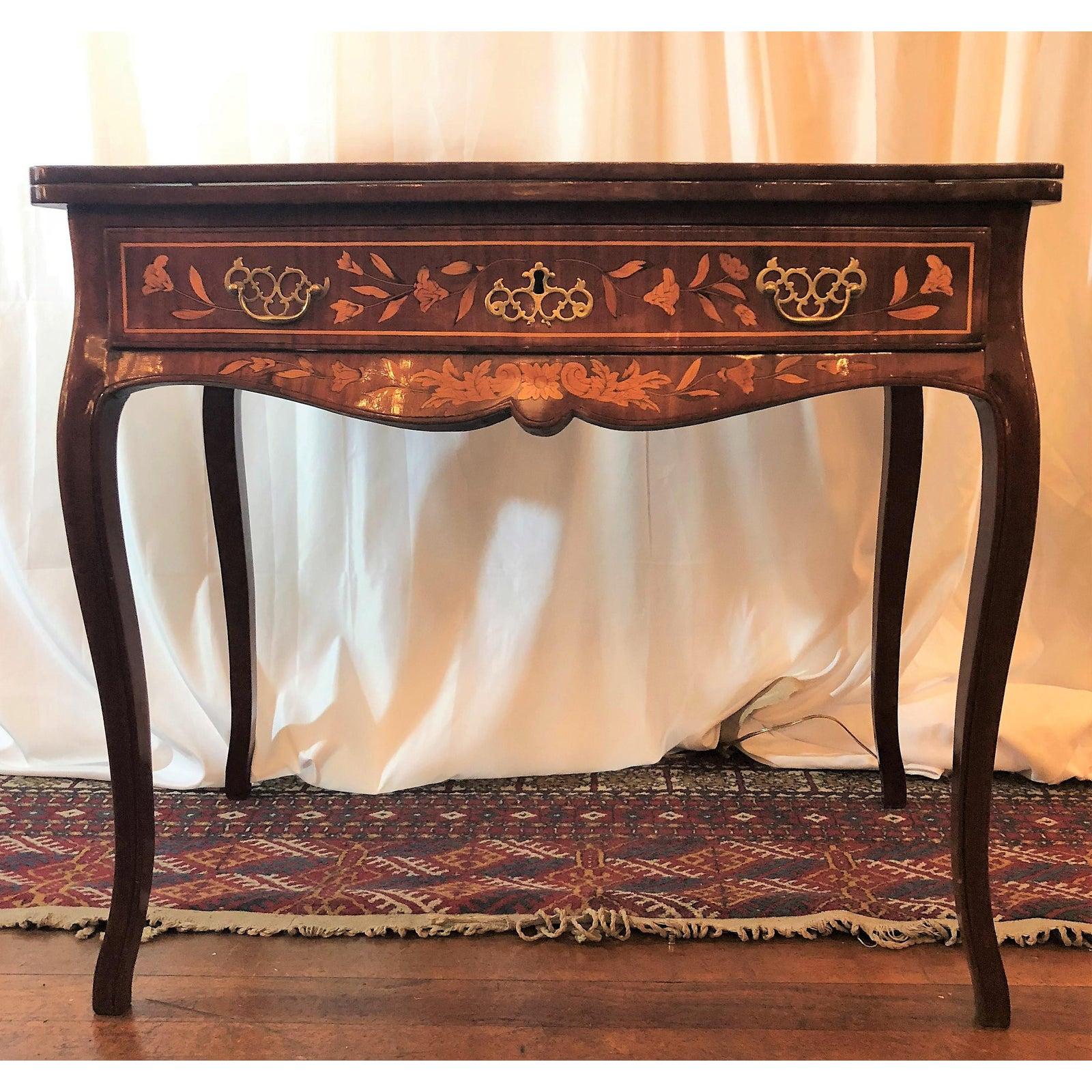 Antique 19th century Dutch marquetry games table, with options for backgammon, chess and checkers. It is beautifully finished. Such a handsome piece!

