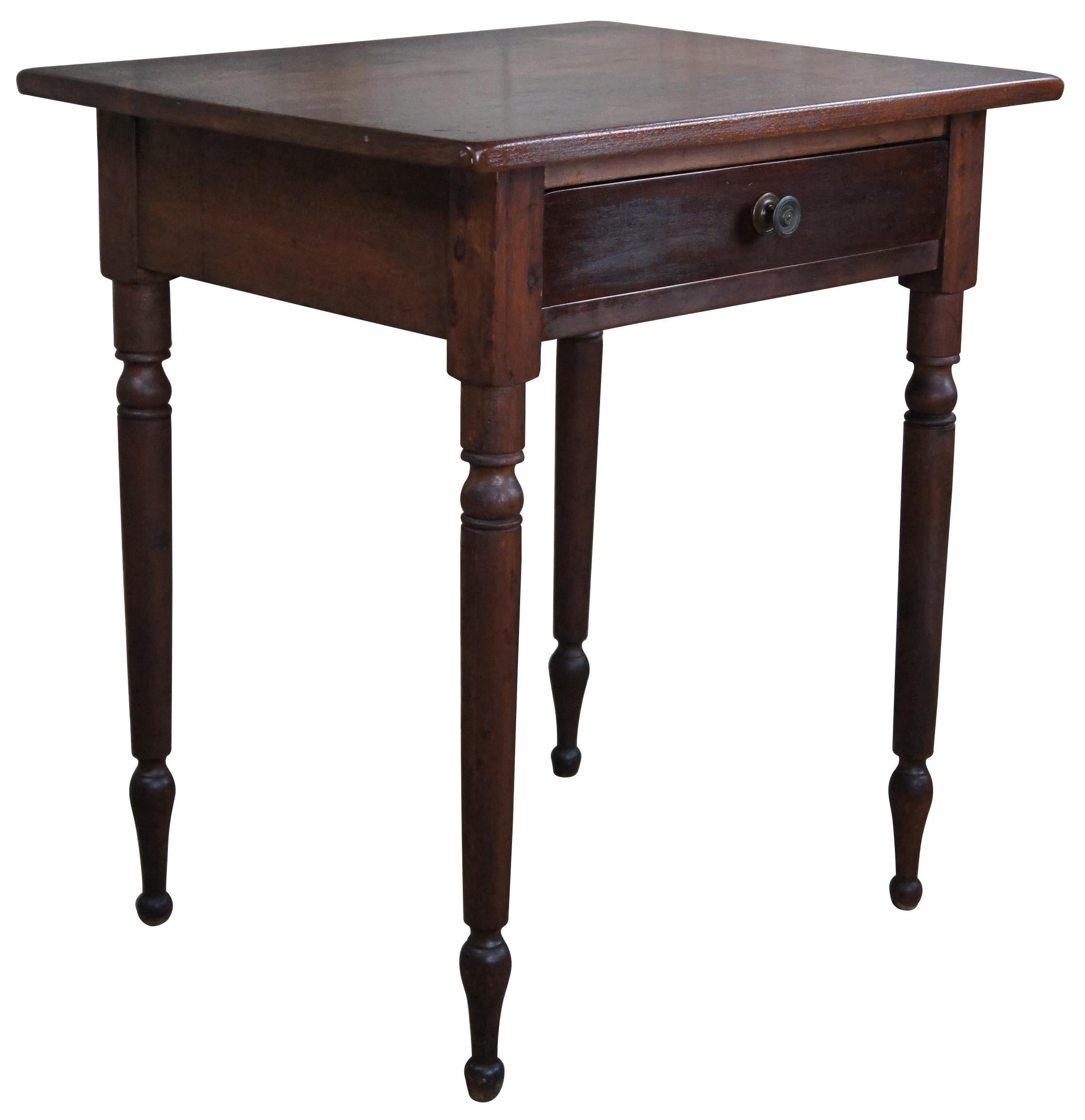 Antique Early American19th century side table or work desk. Made of walnut featuring rectangular form with one drawer, turned legs and primitive hand cut nails, plaining and dovetailing.
 