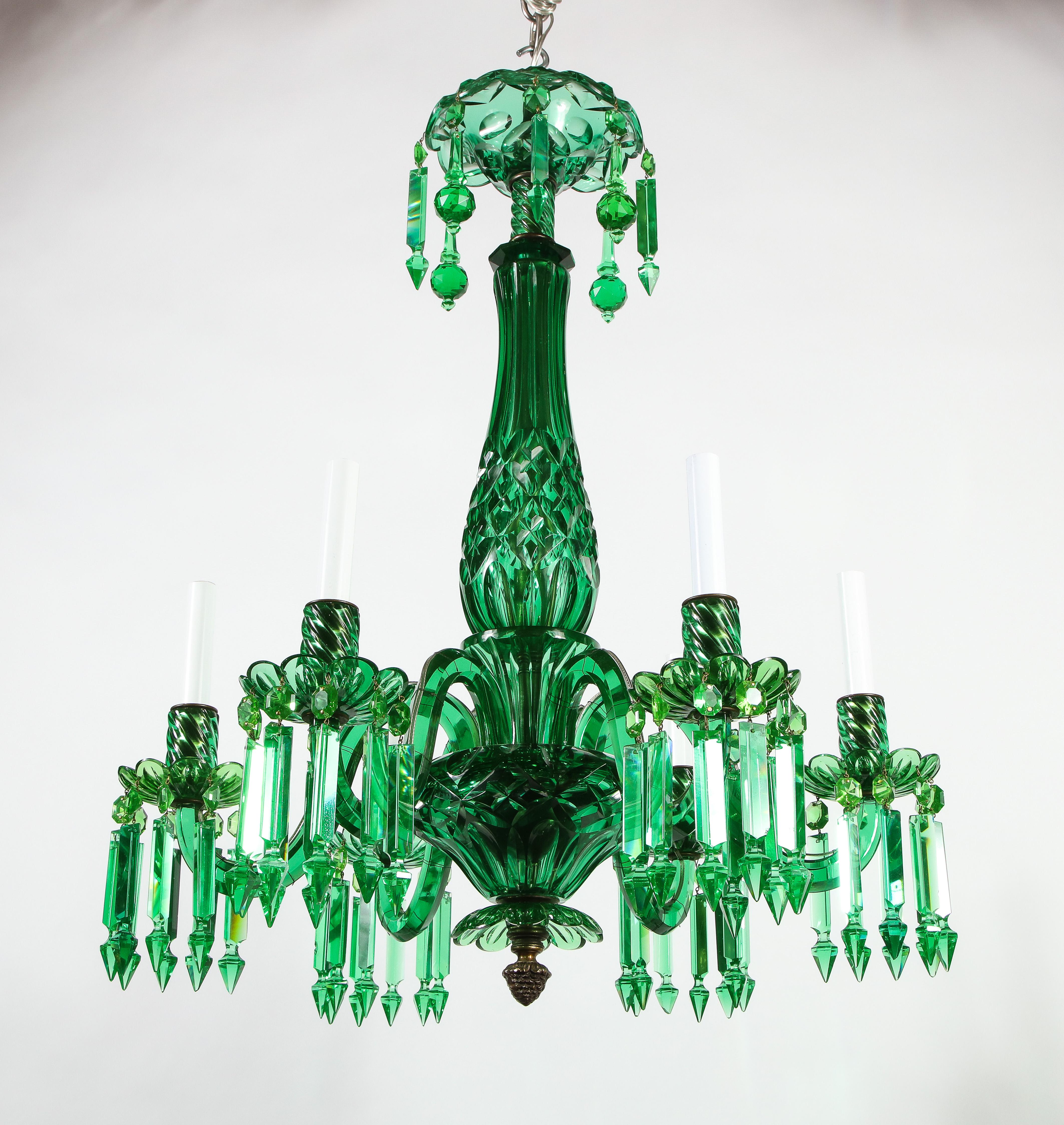 An incredible 19th century English six-arm green crystal chandelier, attributed to F. & C. Osler, London. Each crystal section is beautifully hand-diamond cut with extreme precision. The crystal is made to be a fabulous rich emerald color, which is