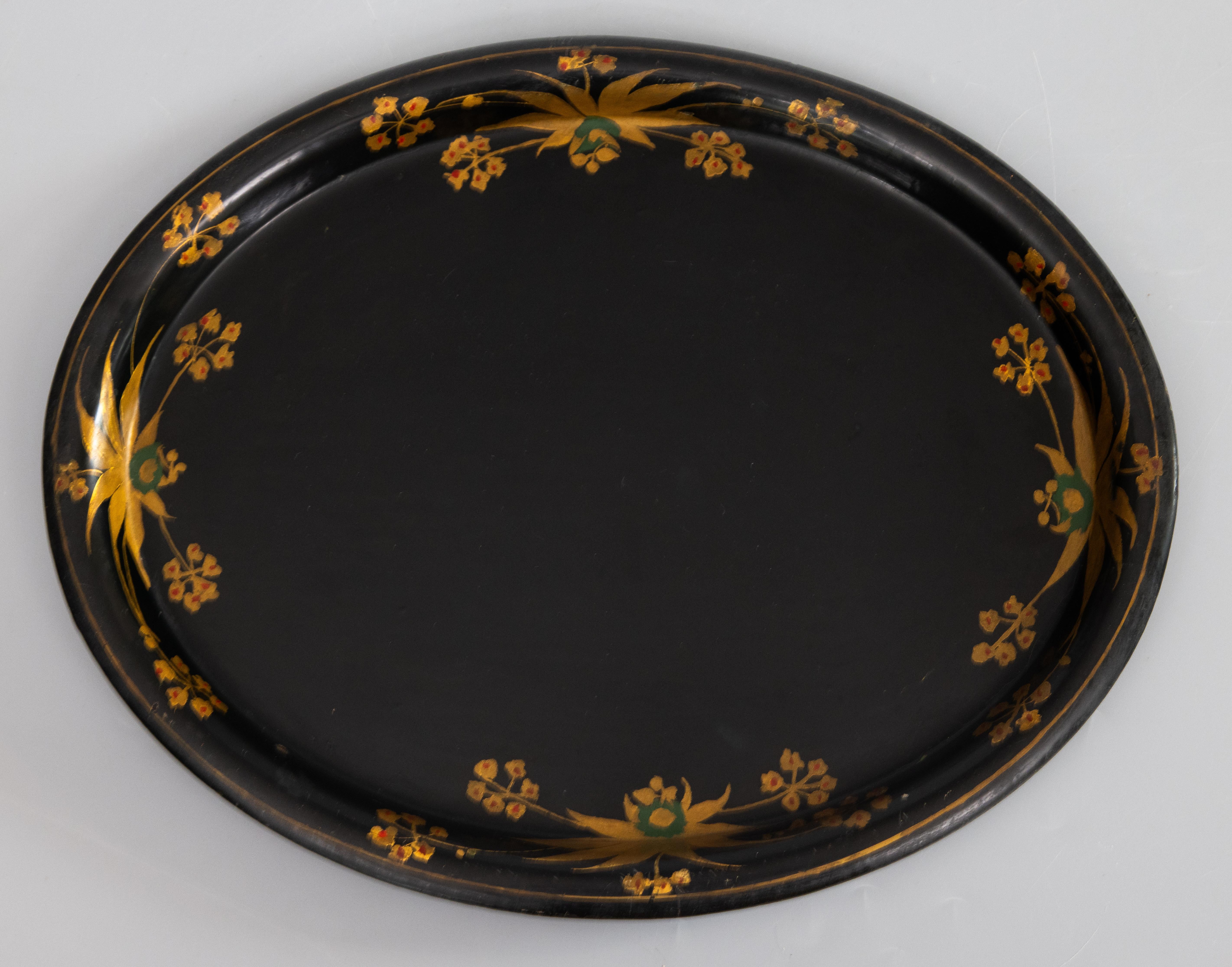 A lovely antique 19th-Century English black tole tray with a hand painted gold gilt leaf and floral border. It displays beautifully, a perfect addition to any room.

Dimensions
13.9ʺW × 11.1ʺD × 0.75ʺH