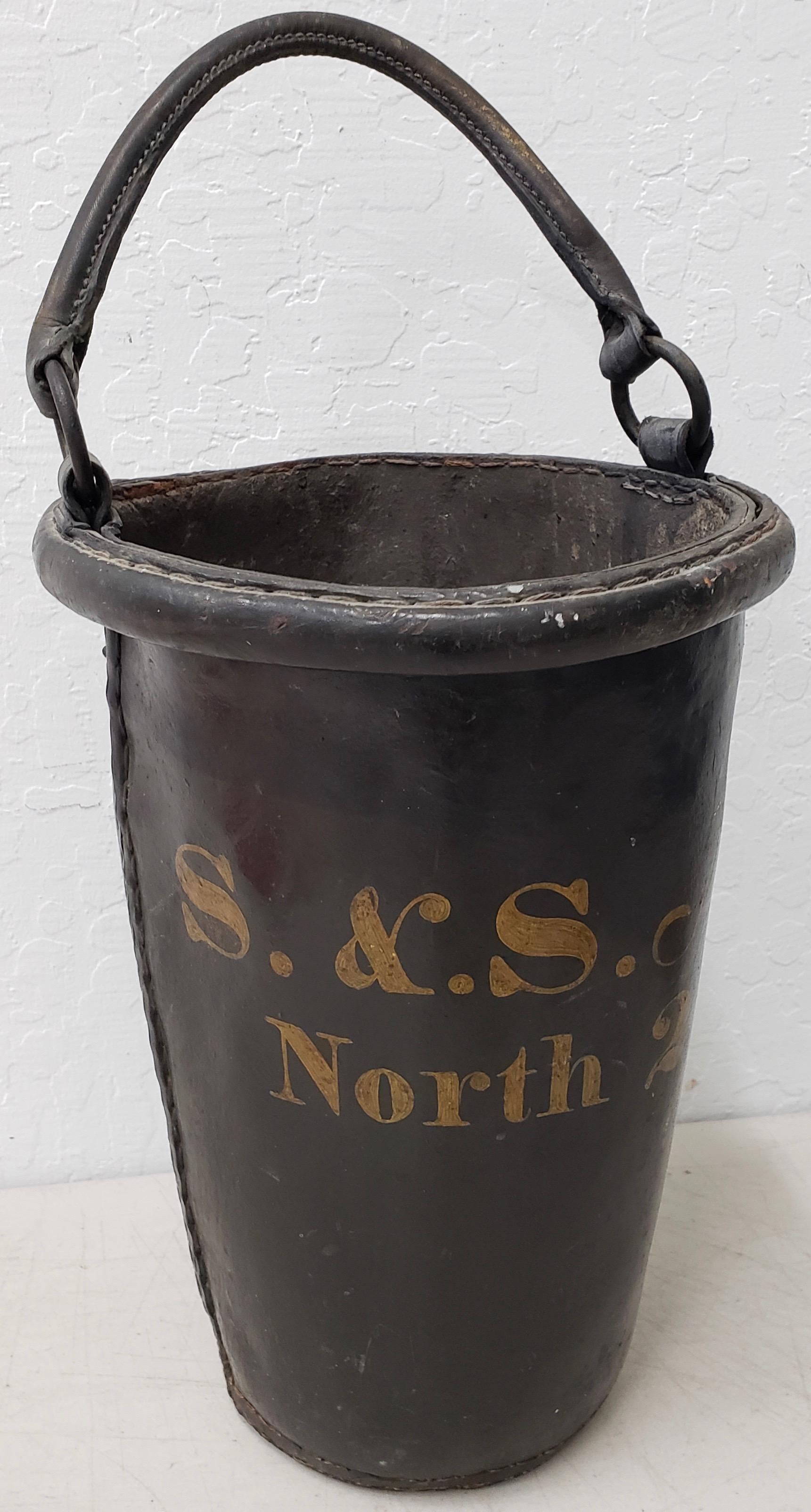 Antique 19th century English leather fire bucket,

circa 1880s

Handmade fire bucket with hand painted station number

Dimensions 6