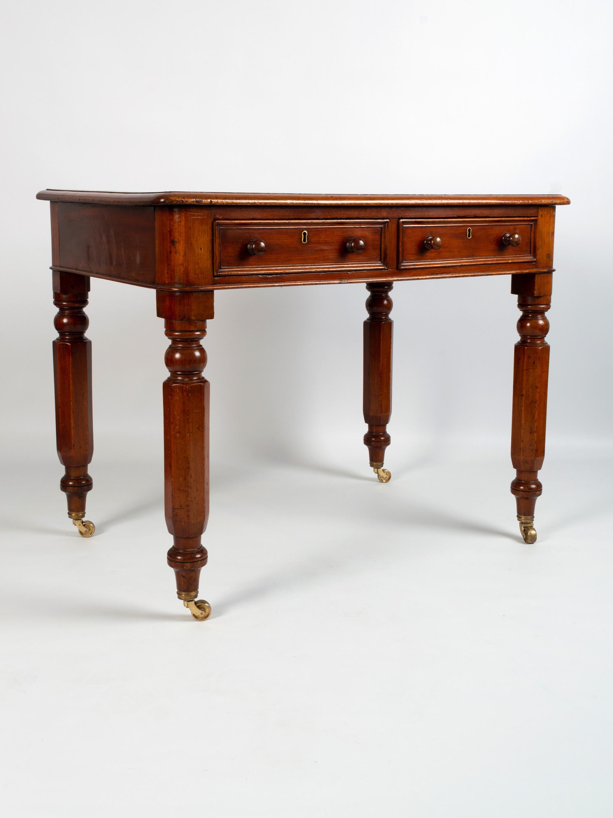 Antique 19th century English Mahogany and leather inset library table C.1840.

A neatly proportioned library desk with two drawers, standing on beautifully turned legs, terminating in brass castors.

This early Victorian example is presented in