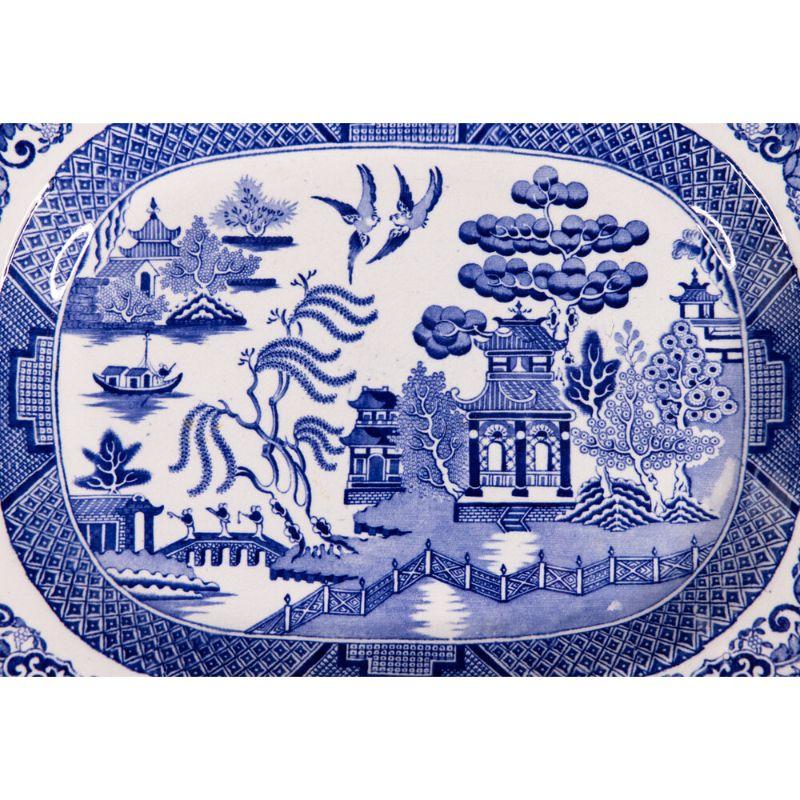 A superb 19th-century English Staffordshire transferware platter in the classic Blue Willow pattern. Like most antique Staffordshire, it is unmarked on the reverse. This lovely platter is a nice large size and would be perfect for serving or