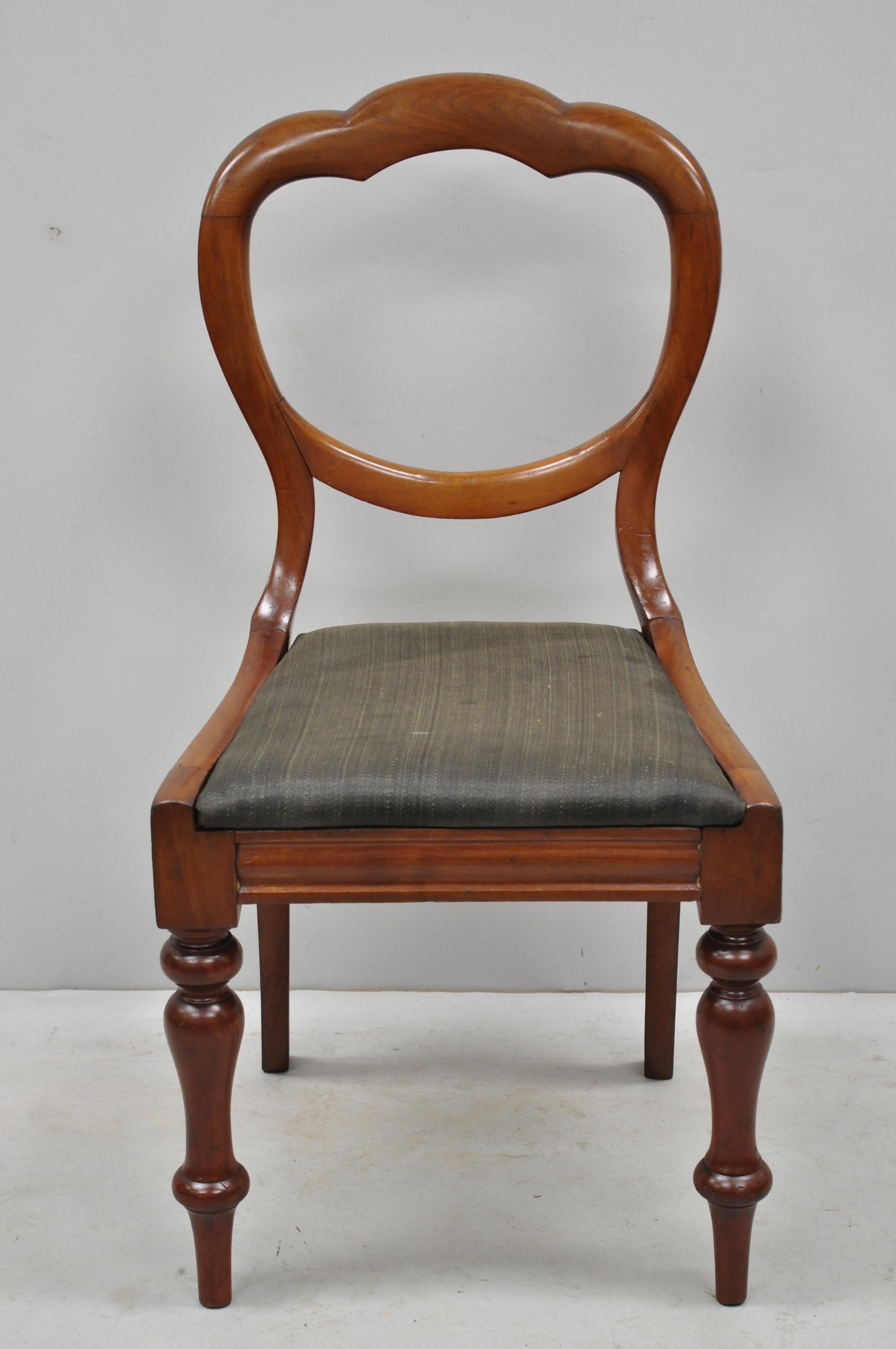 Antique 19th century English Victorian balloon back mahogany library side chairs. Listing features turn carved legs, drop seats, balloon backs, solid wood construction, beautiful wood grain, very nice antique item, circa 19th century. Measurements: